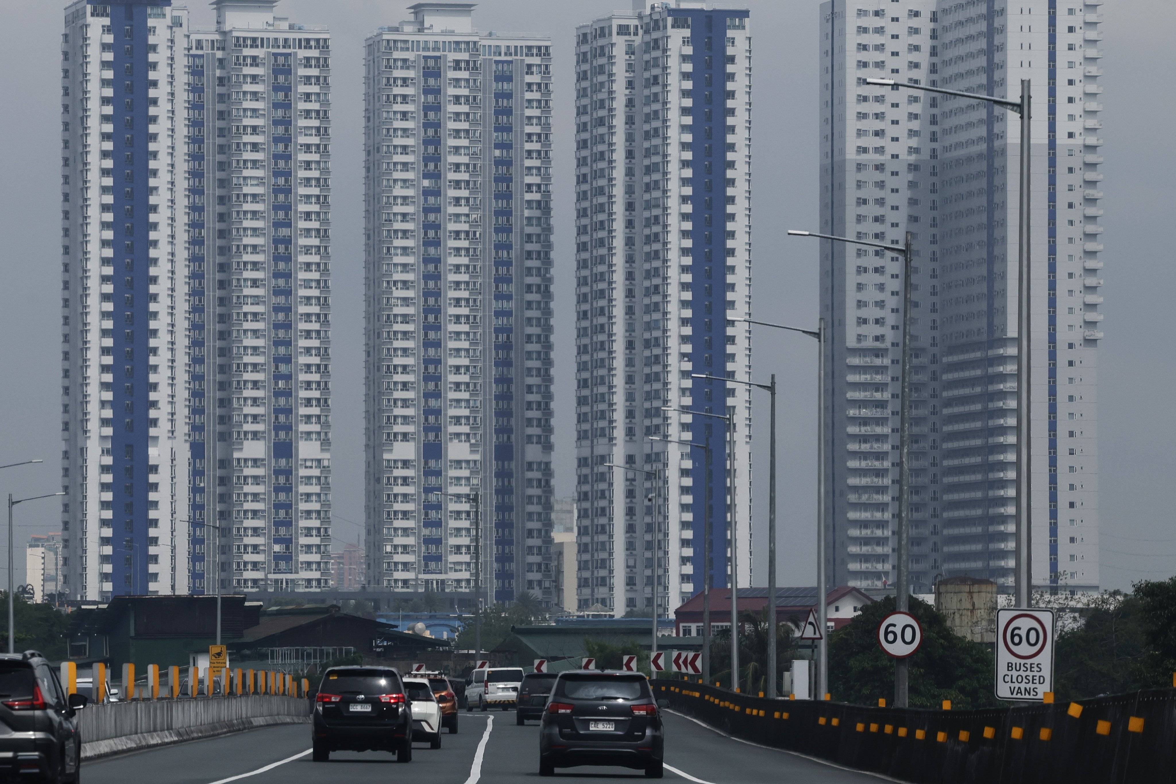 High-rise buildings are seen at a distance from a highway section in Metro Manila, the Philippines, in September. Photo: EPA