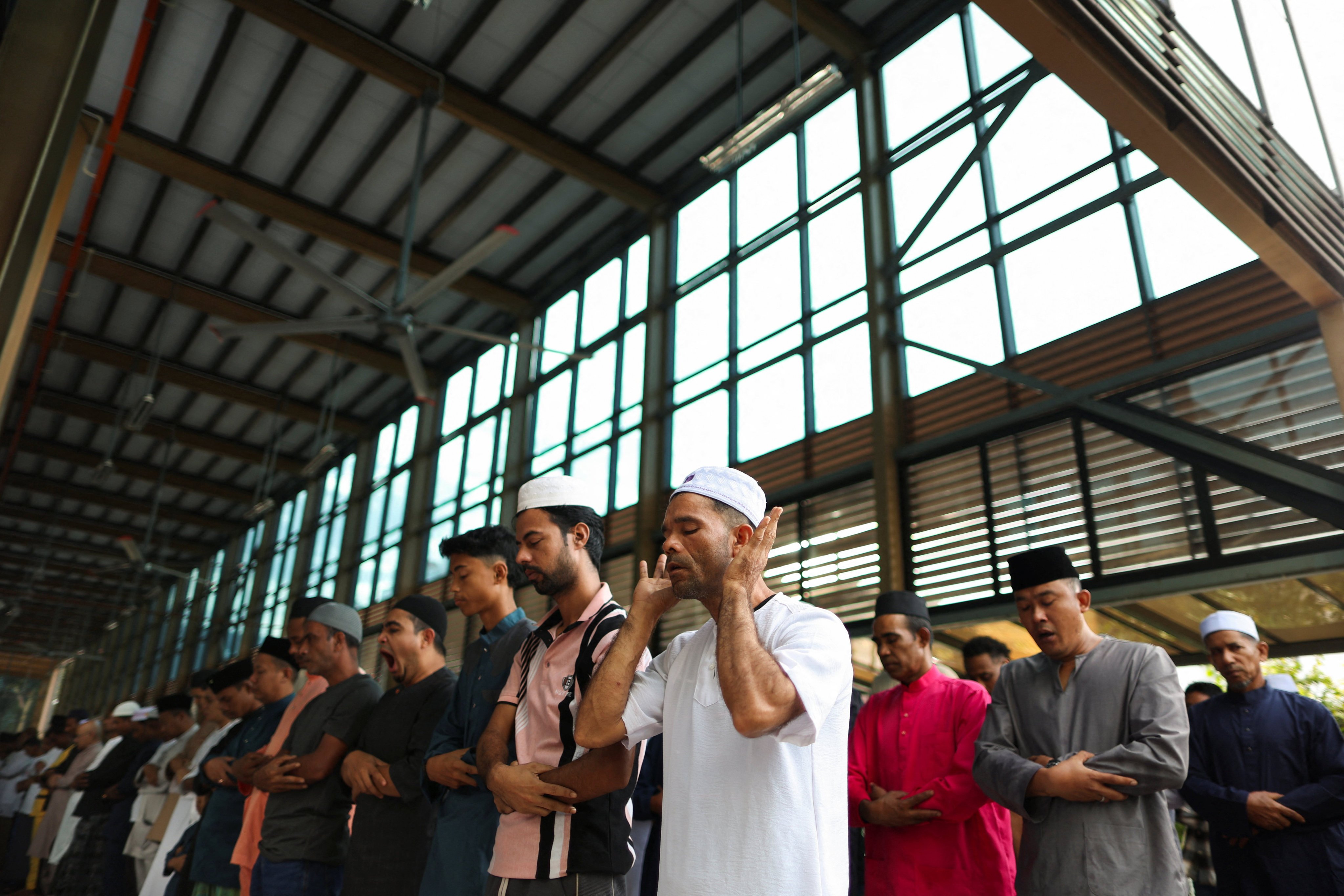 Muslims pray at a mosque in Ampang, Malaysia, in May. Photo: Reuters