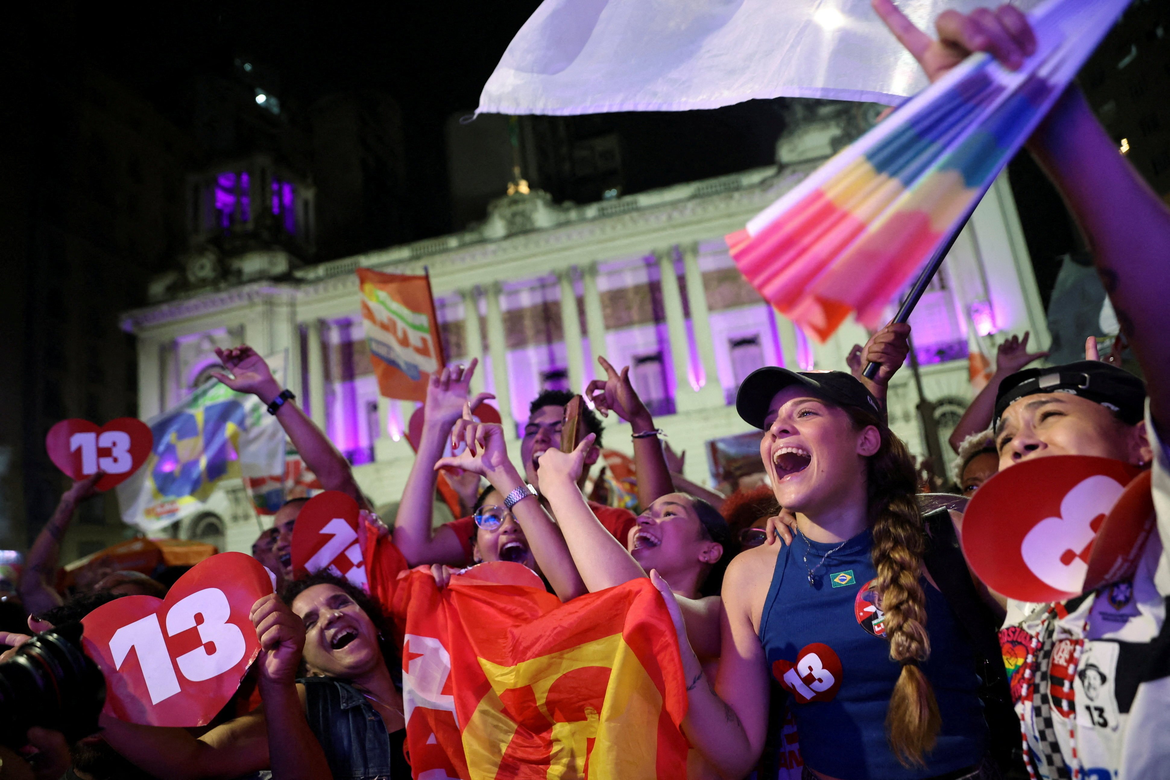 Supporters of Brazilian President Luiz Inacio Lula da Silva watch the results. Photo: Reuters