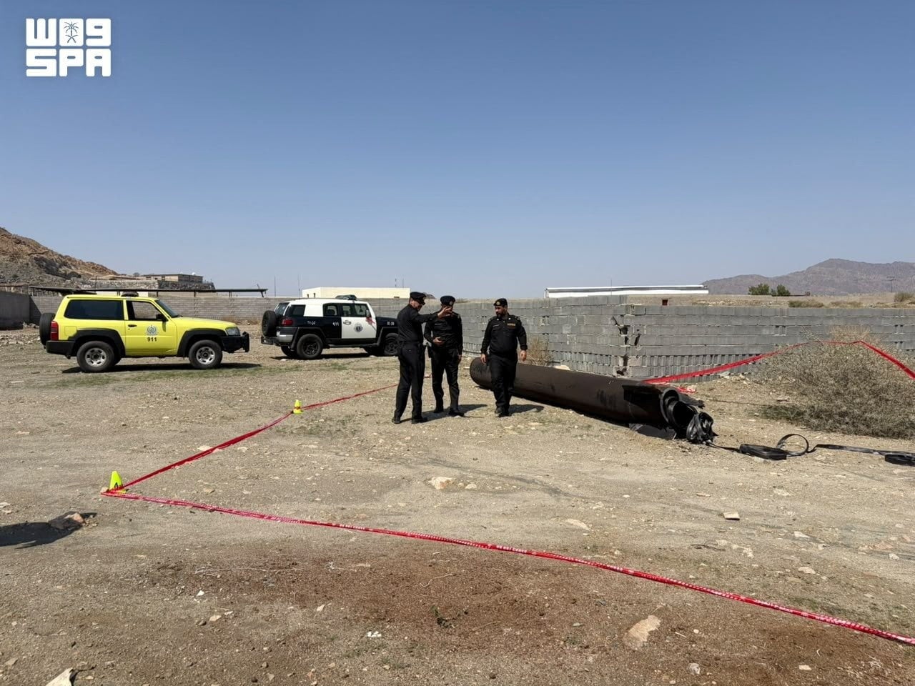 Saudi security officials inspect debris from an intercepted ballistic missile near Mecca on October 24, amid a barrage of Houthi strikes targeting the kingdom. Photo: SPA via Reuters