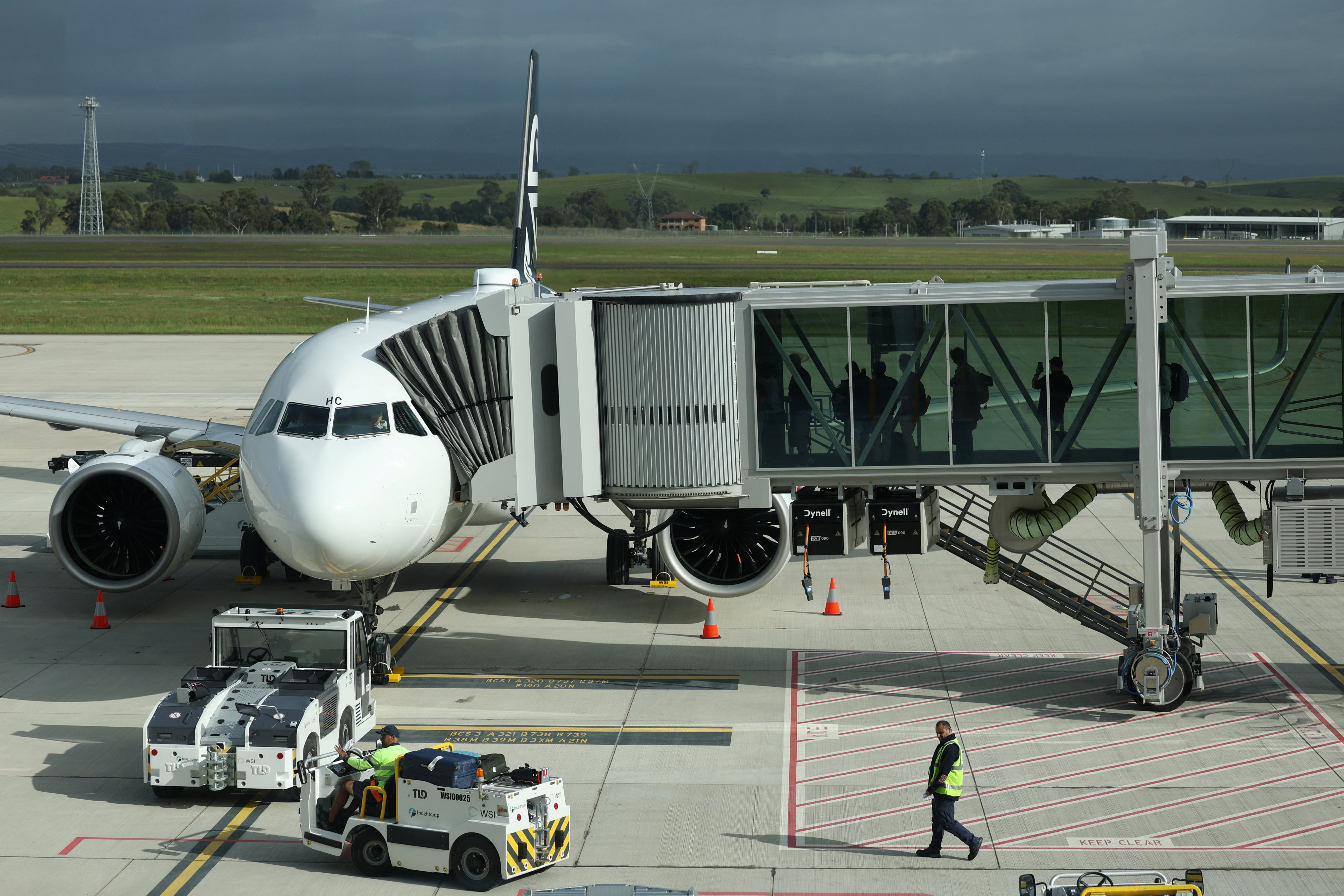 Passengers board Air New Zealand NZ166, the first international flight to leave the new Western Sydney International on Monday. Photo: Reuters
