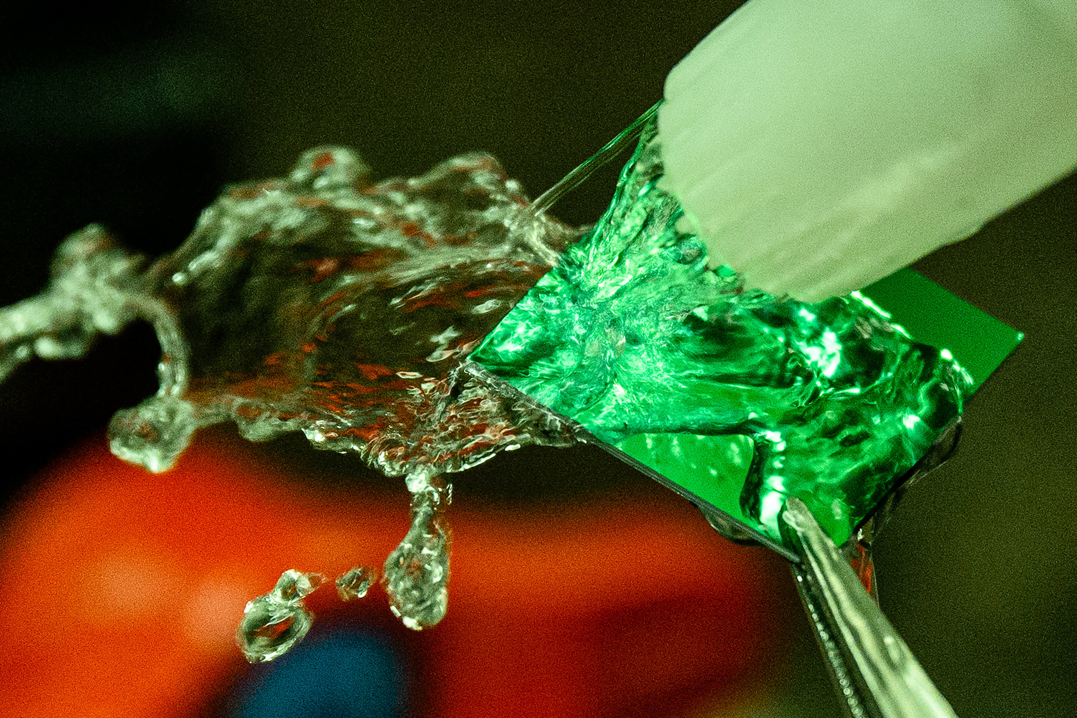 A student at Seoul National University’s Inter-university Semiconductor Research Centre washes a semiconductor chip diced from a wafer in South Korea. Photo: AFP