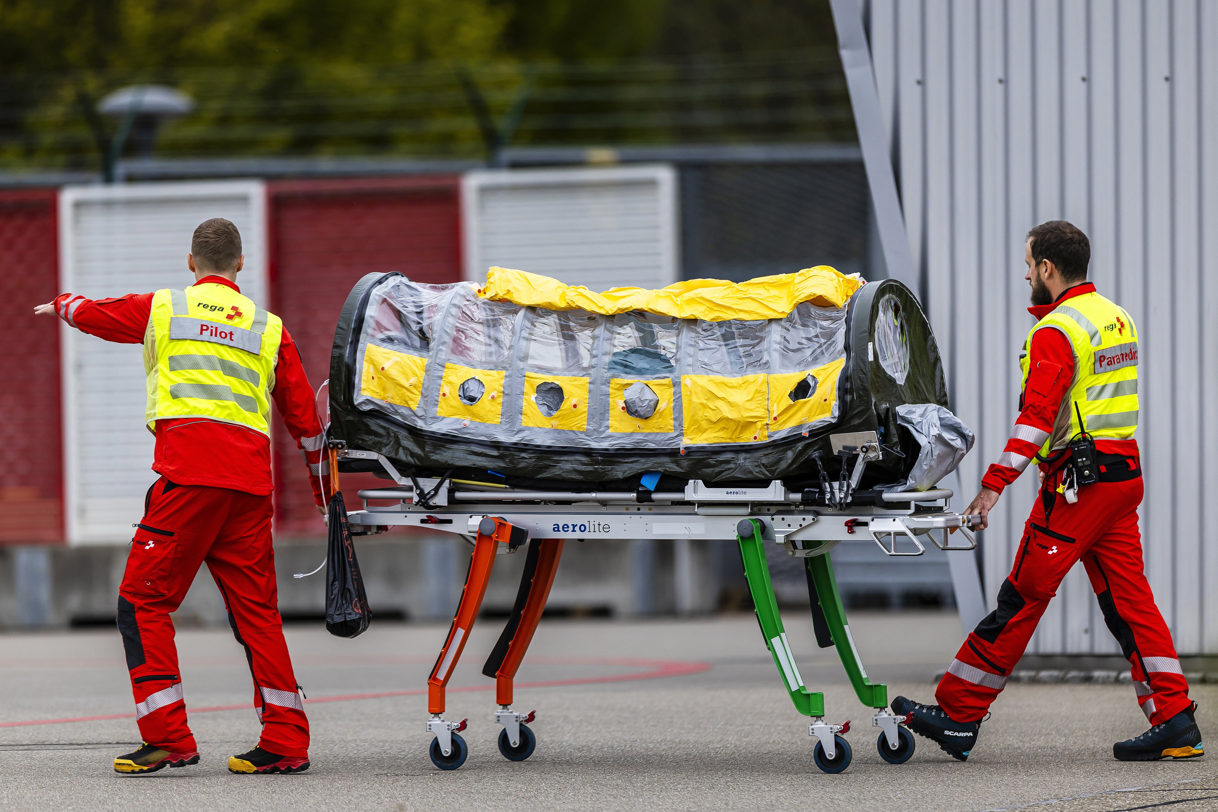 An Ebola patient is transported inside an isolation unit at Zurich Airport, Switzerland, on Monday. Photo: EPA