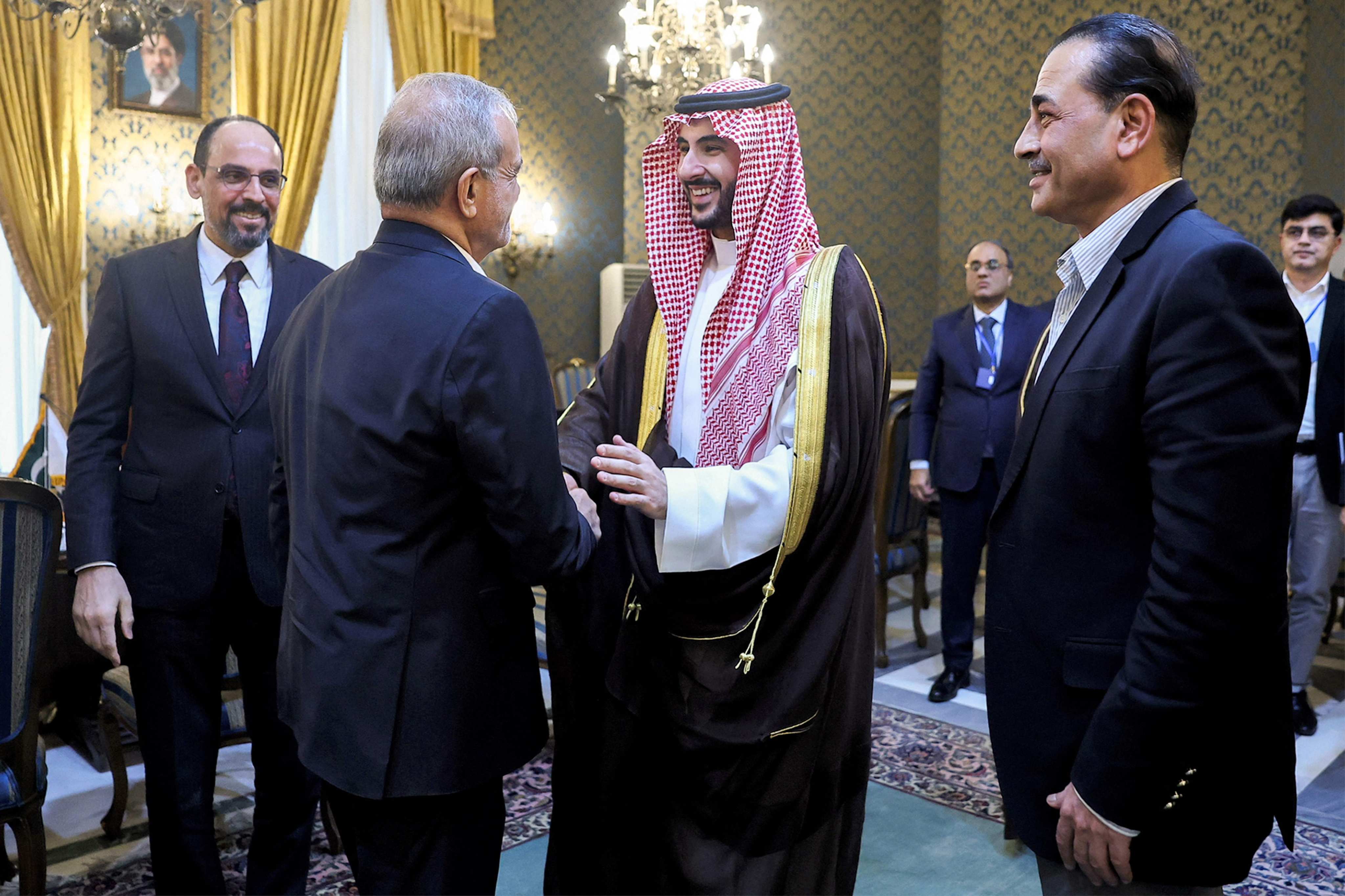 Iran’s President Masoud Pezeshkian shakes hands with Saudi Arabia’s Defence Minister Prince Khalid bin Salman al-Saud in Tehran on Monday. Photo: Iranian Presidency via AFP