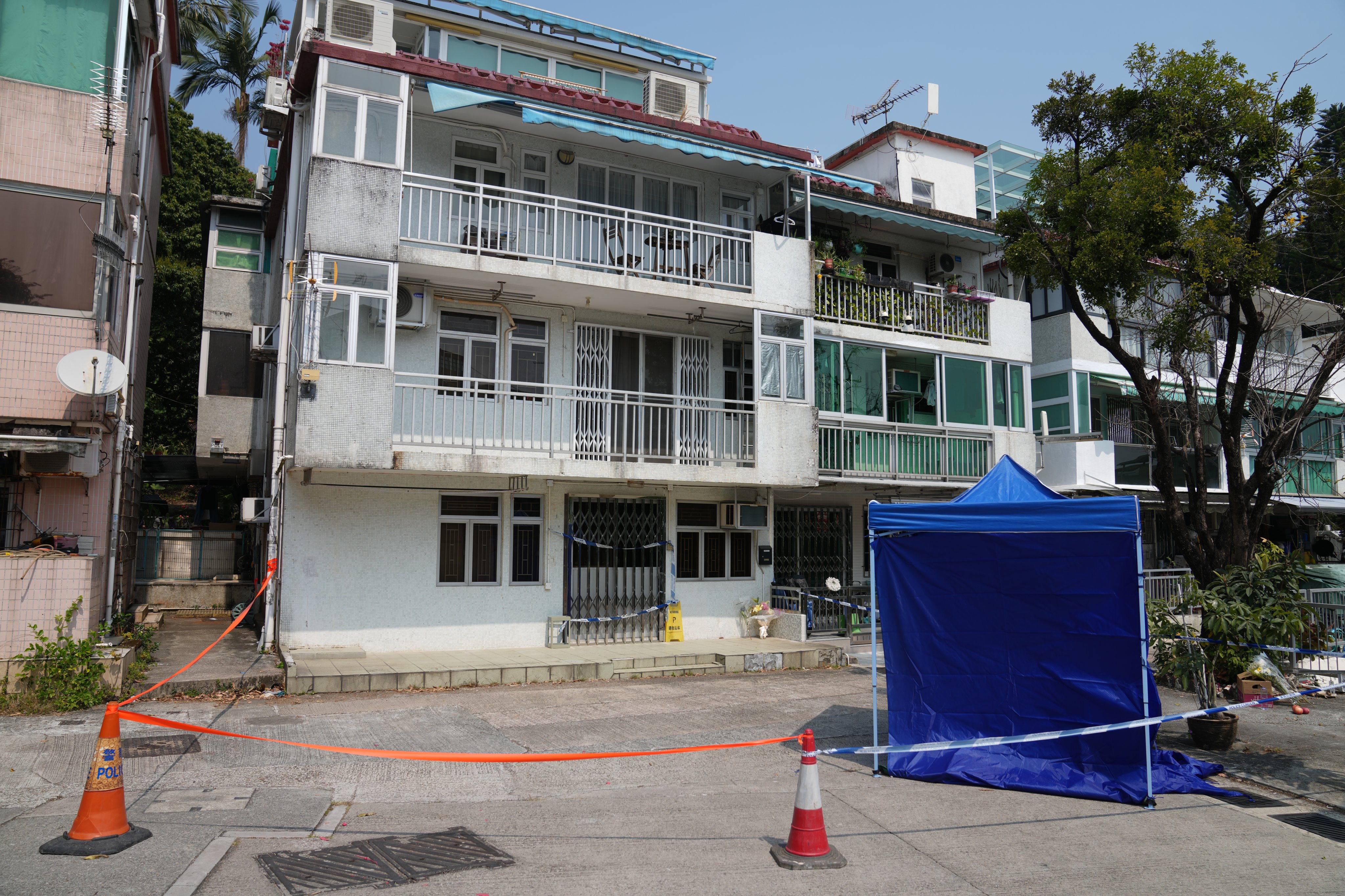 Police cordoned off a 600 square foot rental flat in Tai Po’s Lung Mei village after human remains were found inside.  Photo: Sam Tsang