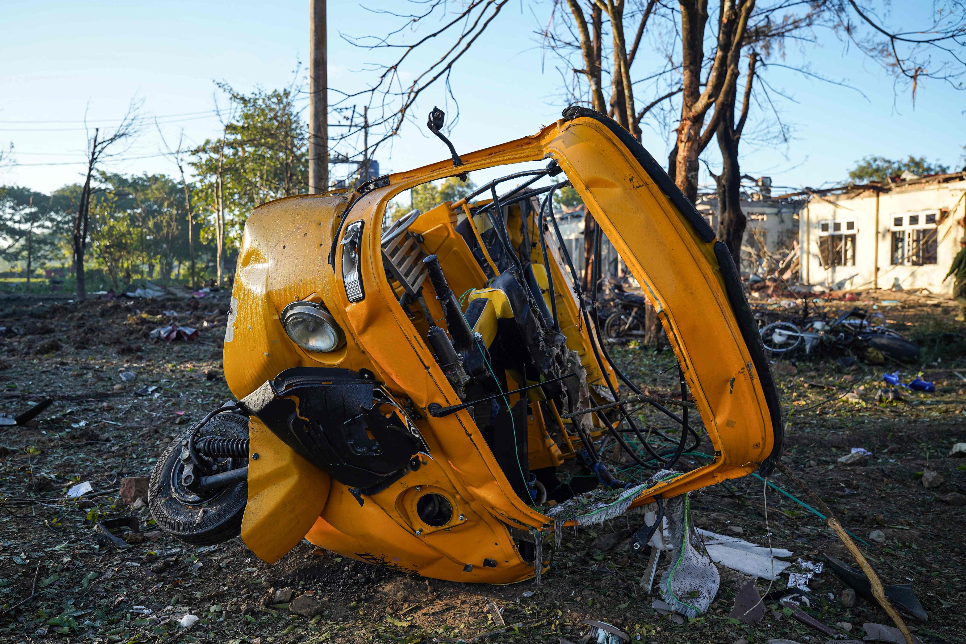 A vehicle lies damaged after a Myanmar military air strike that killed more than 30 people at a hospital in Mrauk U, western Rakhine state, on December 11, 2025. Photo: AFP