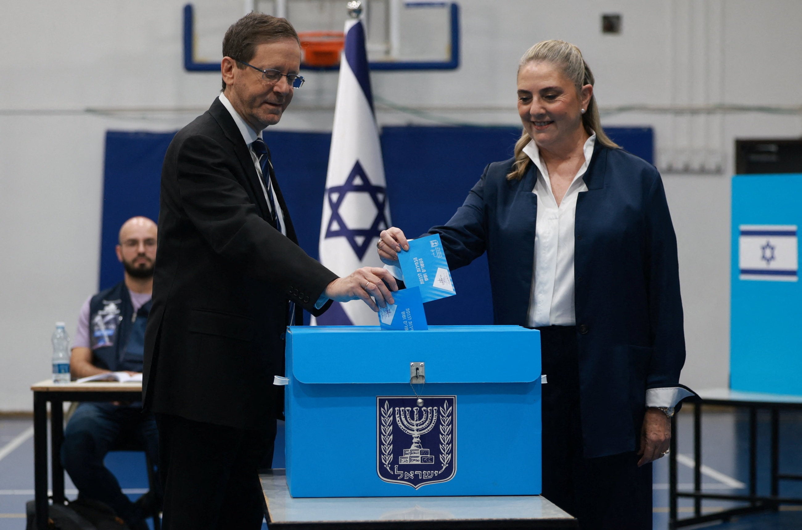 Israeli President Isaac Herzog and his wife Michal Herzog vote in Jerusalem. Photo: Reuters