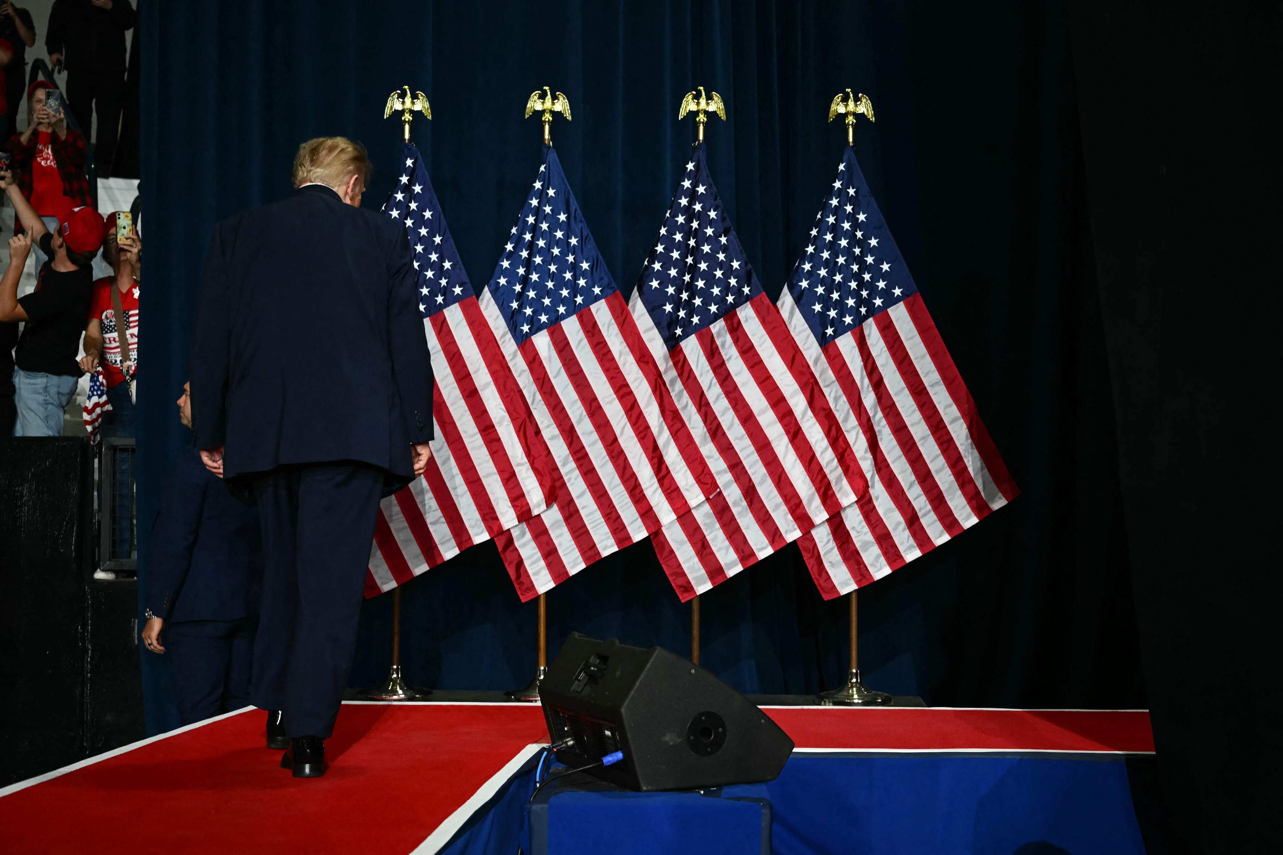 US President Donald Trump walks off stage at a midterm campaign rally at Crossroads Arena in Corinth, Mississippi, on Sunday. Photo: AFP
