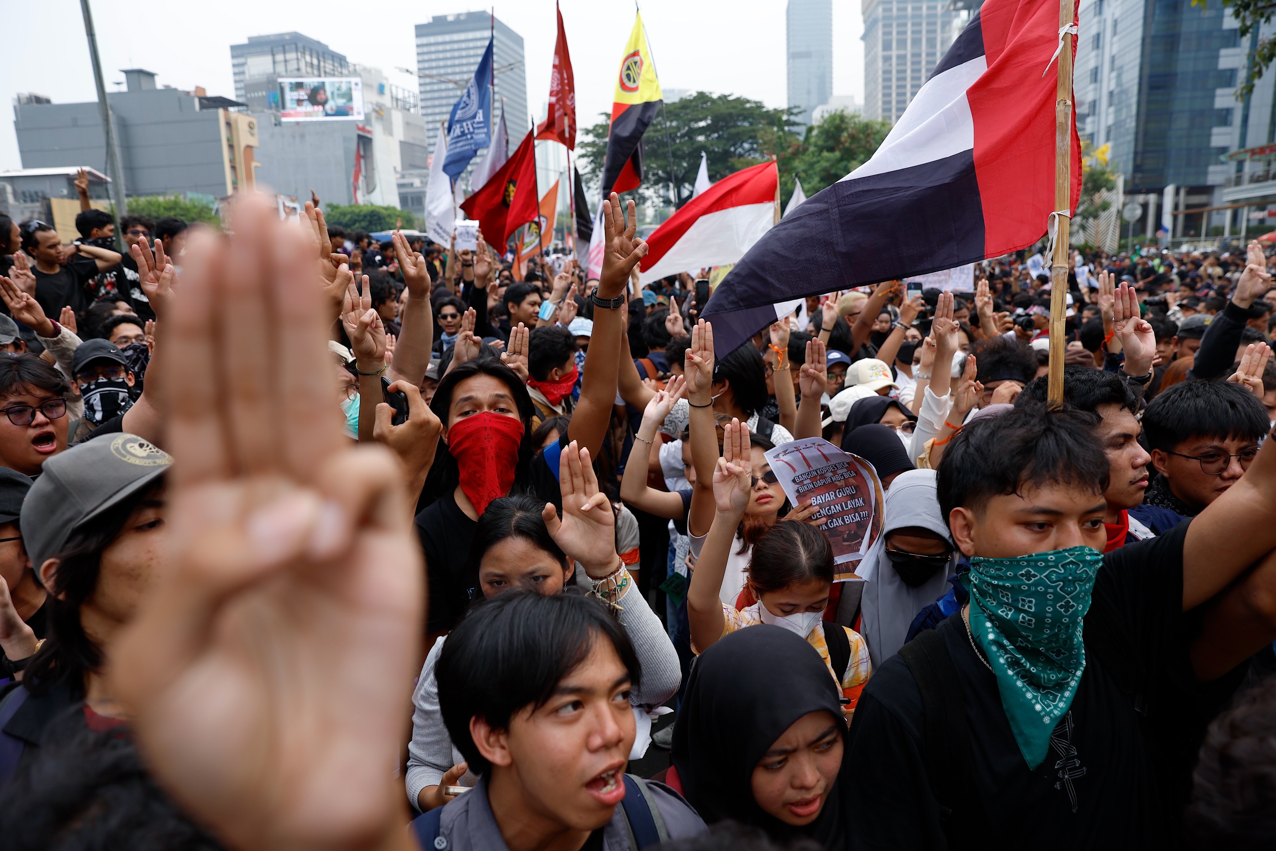 Students shout slogans and raise the three-finger salute, a symbol of resistance, during a protest against the government in Jakarta, Indonesia, on Wednesday. Hundreds of students staged a protest urging the government to declare a national disaster over wildfires and haze, control over the state budget, and lower fuel and basic necessities prices. Photo: EPA
