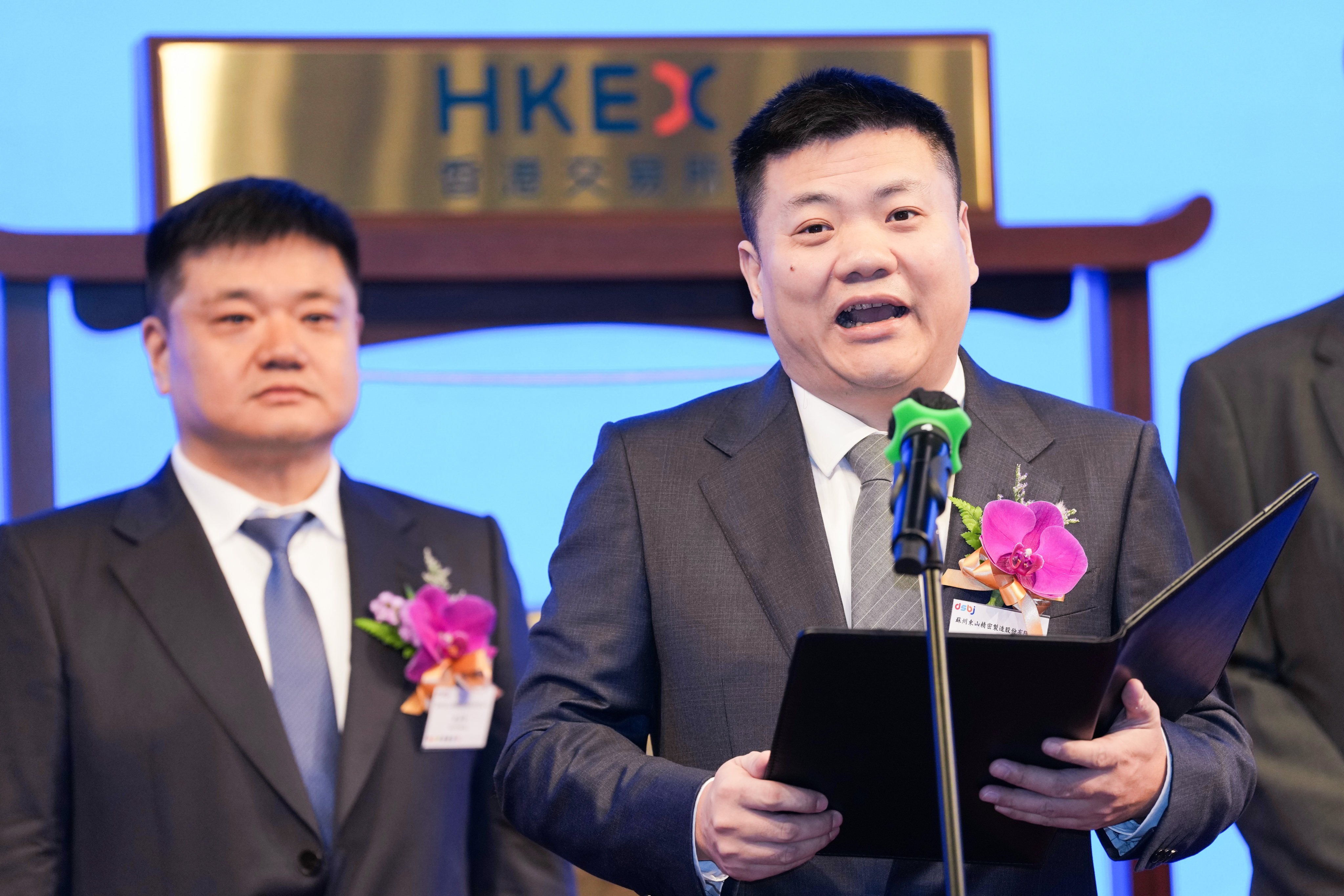 The Suzhou Dongshan Precision Manufacturing listing ceremony, attended by company general manager Yuan Yongfeng (left) and chairman Yuan Yonggang, at the Hong Kong Stock Exchange in Central. Photo: Karma Lo