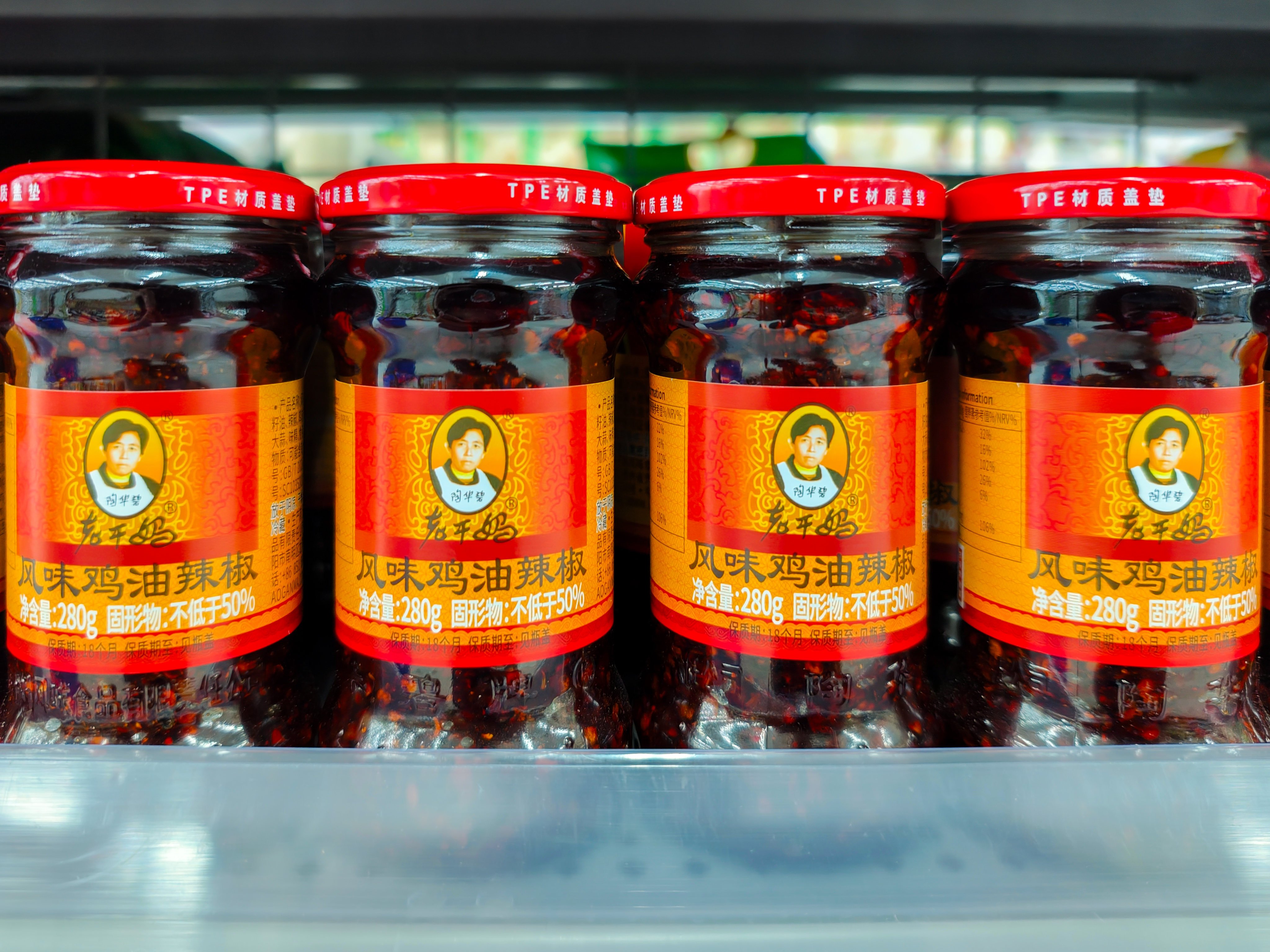 Bottles of Lao Gan Ma chilli sauce are displayed on shelves for sale at a supermarket on October 26 in Guangzhou, China’s Guangdong province. Photo: Getty Images