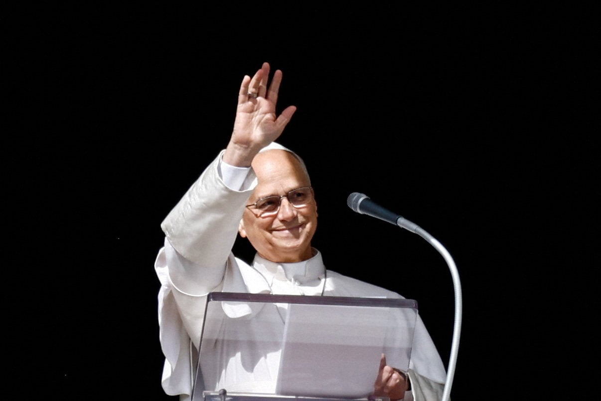 Pope Leo waves as he leads the Angelus prayer at the Vatican on Sunday. Photo: Reuters