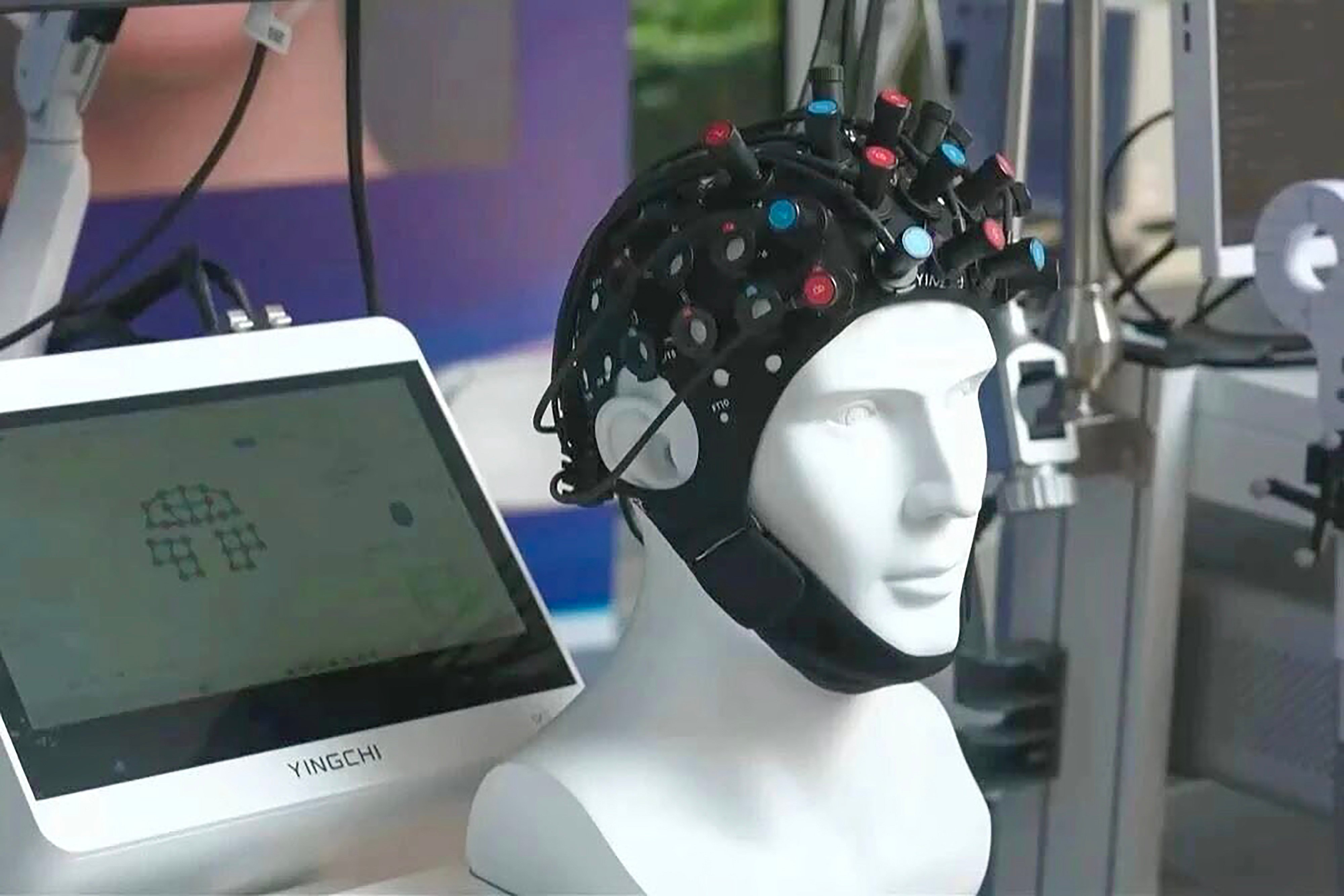 A new brain-computer interface technology developed by researchers in Shenzhen offers a non-invasive way to communicate with the brain. Photo: CCTV