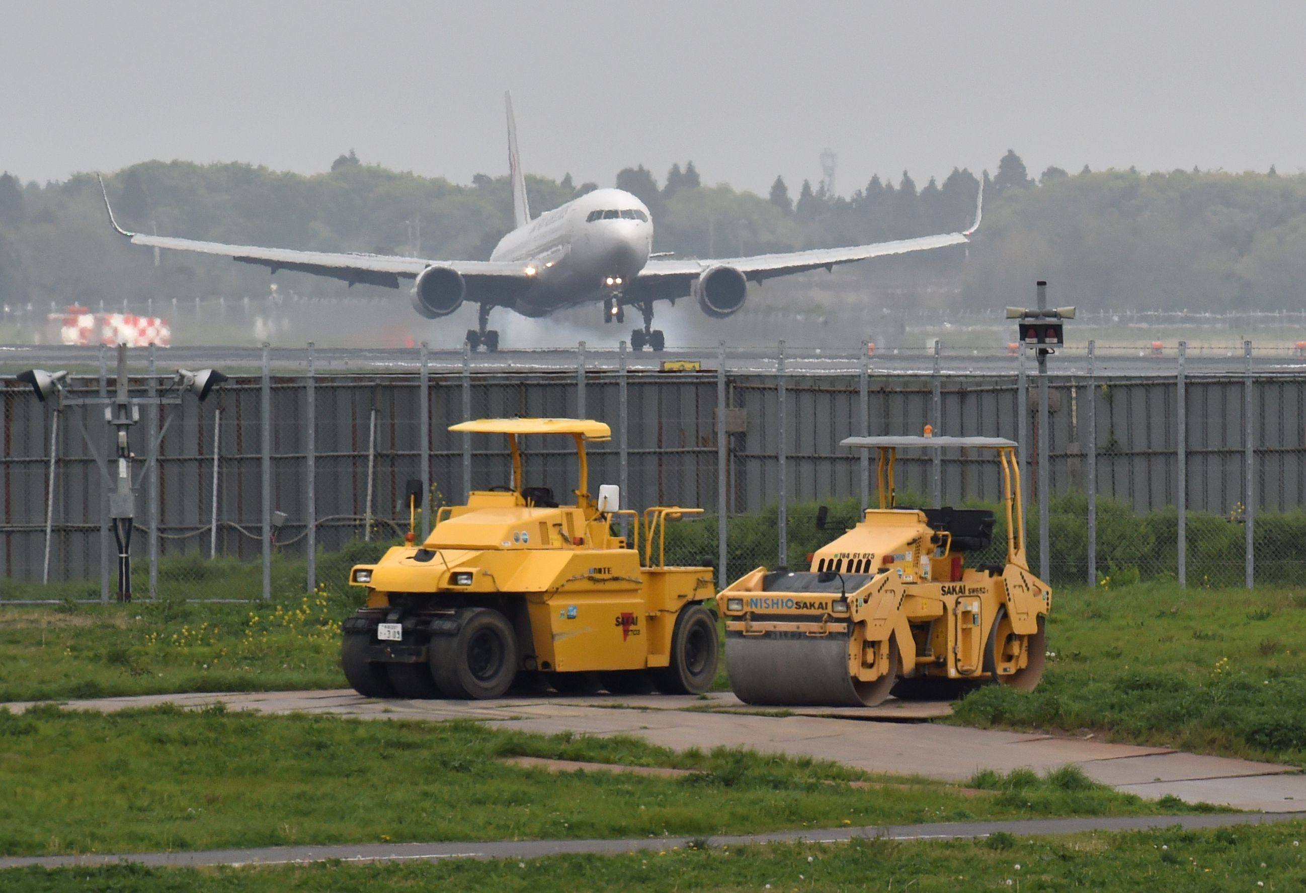 A plane lands on a runway of the expanding Narita International Airport in Chiba prefecture. Photo: AFP