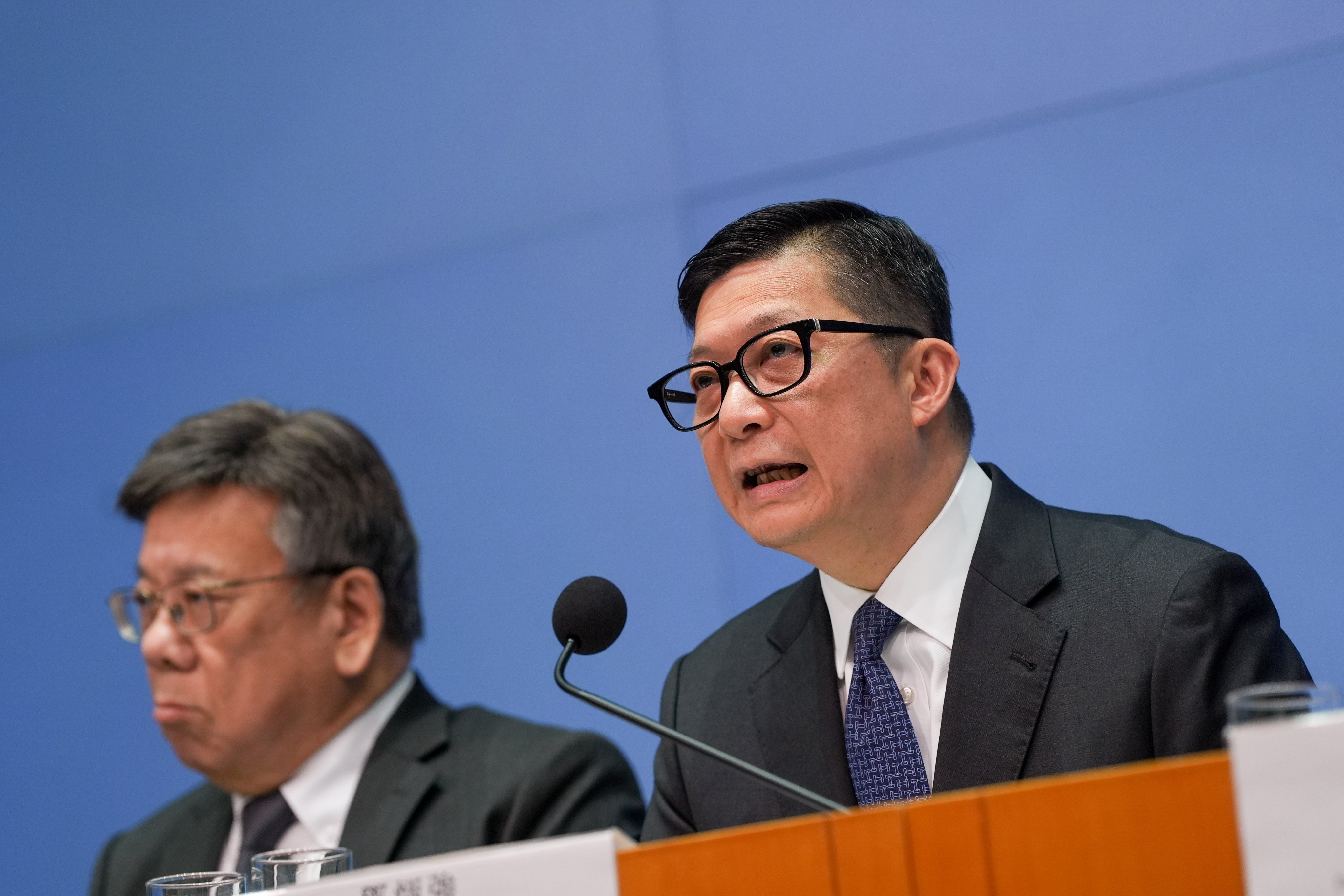 “Society is important, Hong Kong is important, the country is important,” security chief Chris Tang said when asked about his views on resigning. At left 
is Secretary for Commerce and Economic Development Algernon Yau. Photo: Elson Li