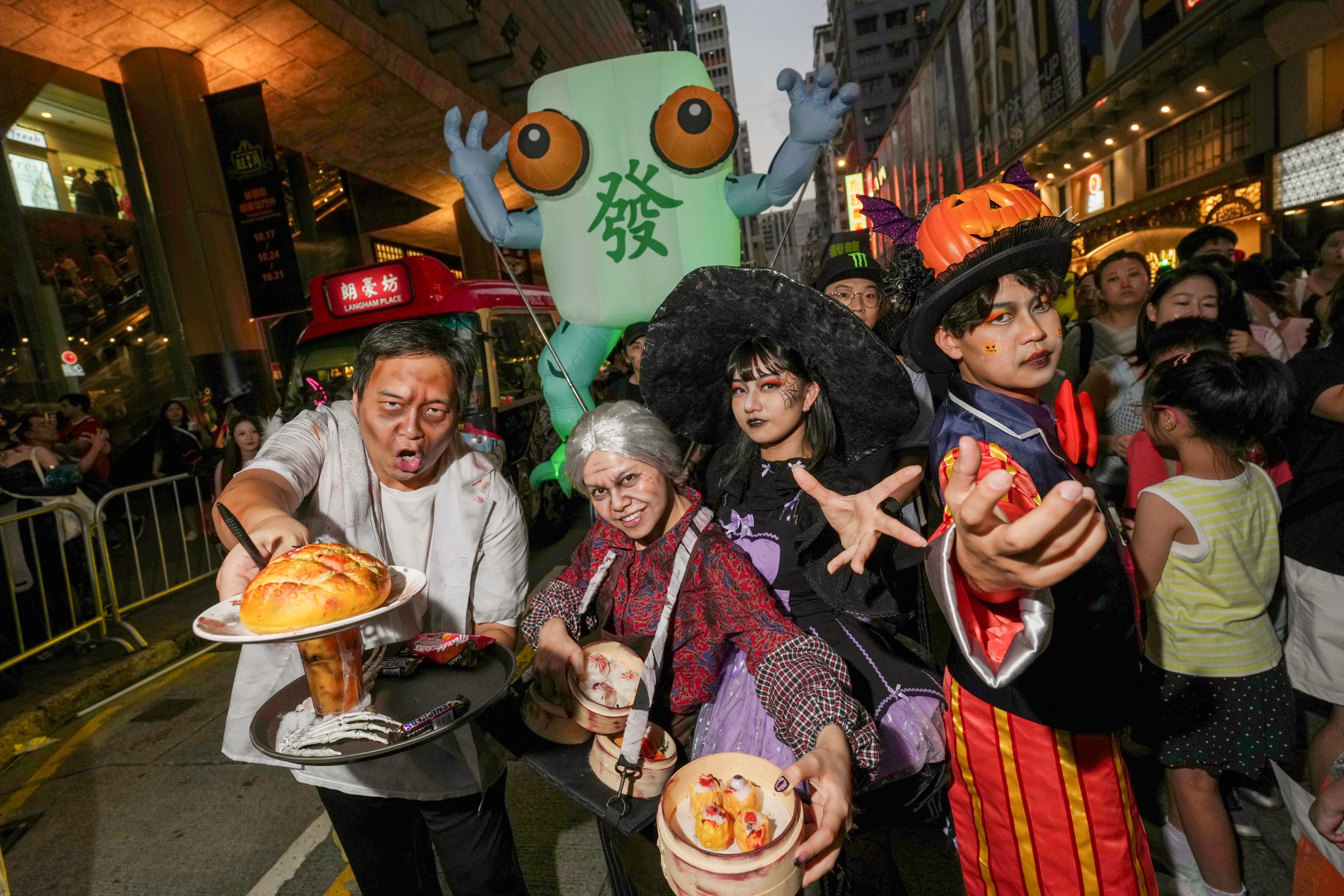 Revellers outside Mong Kok’s Langham Place. Photo: Kit Lai