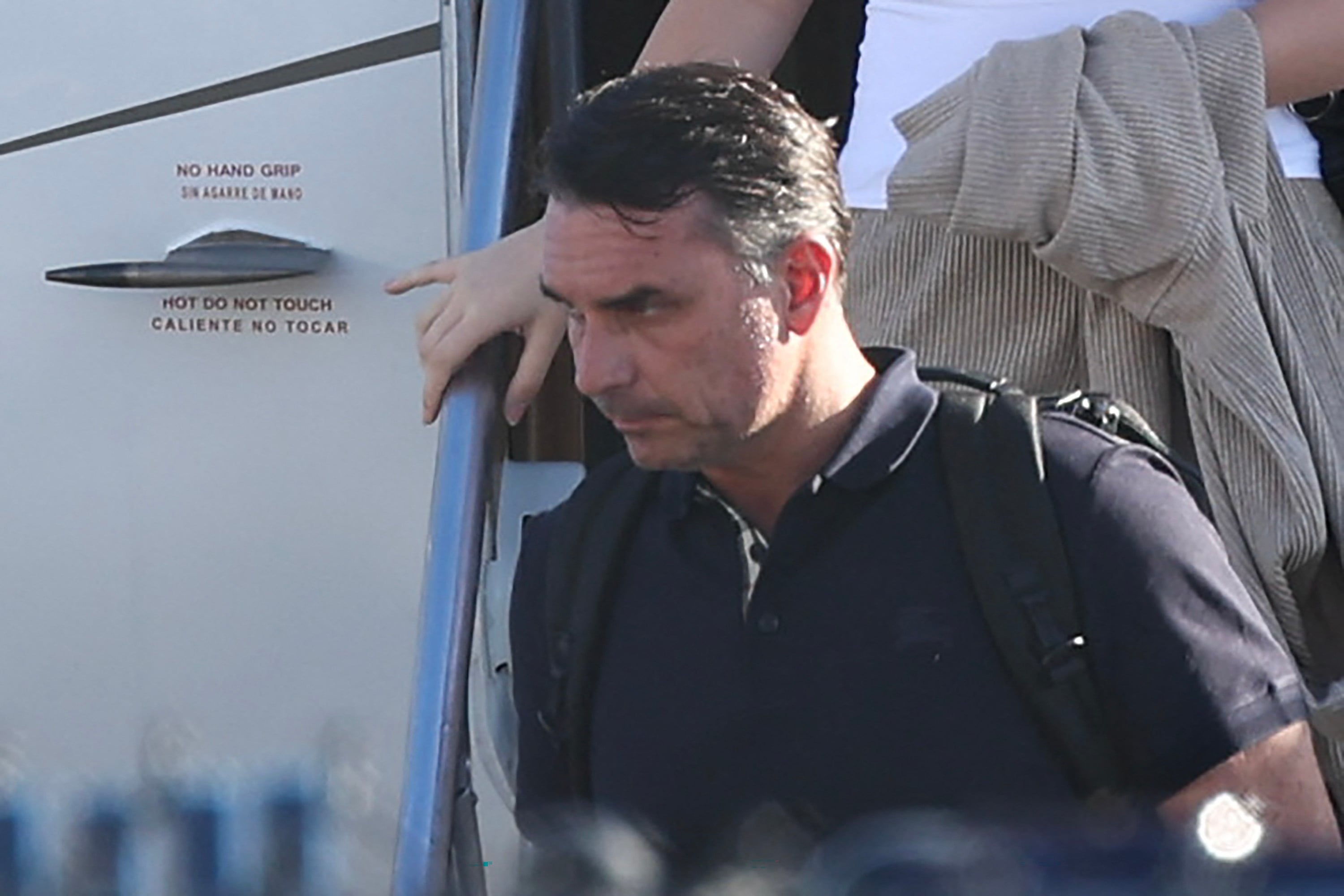 Defeated Brazilian presidential candidate Flavio Bolsonaro steps off a private jet at Miami-Opa Locka Executive Airport in Florida on Wednesday, having left Brazil in defiance of a court travel ban. Photo: AFP