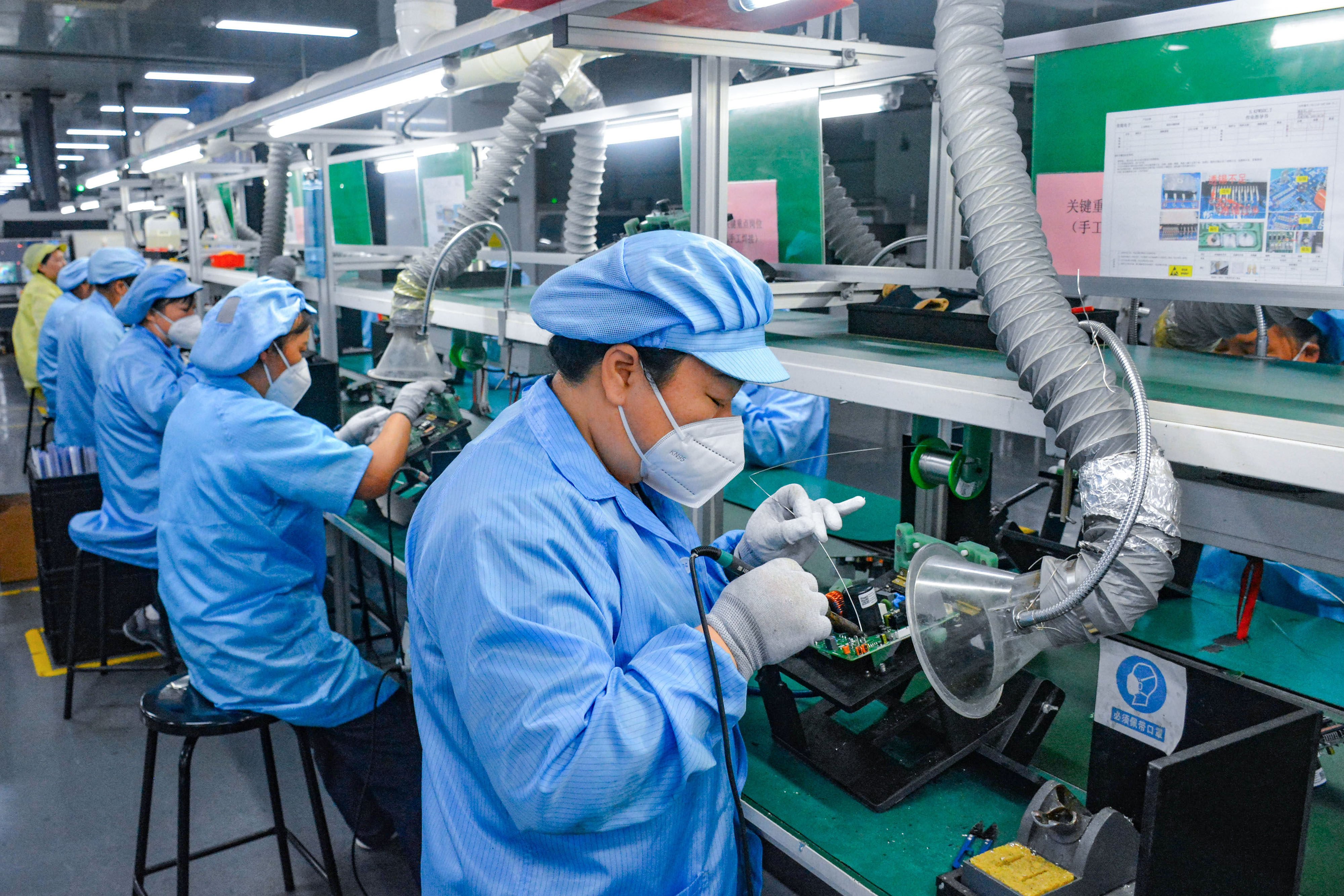 Workers produce electronics at a factory in China’s Anhui province on September 9, 2026. Photo: VCG via Getty Images