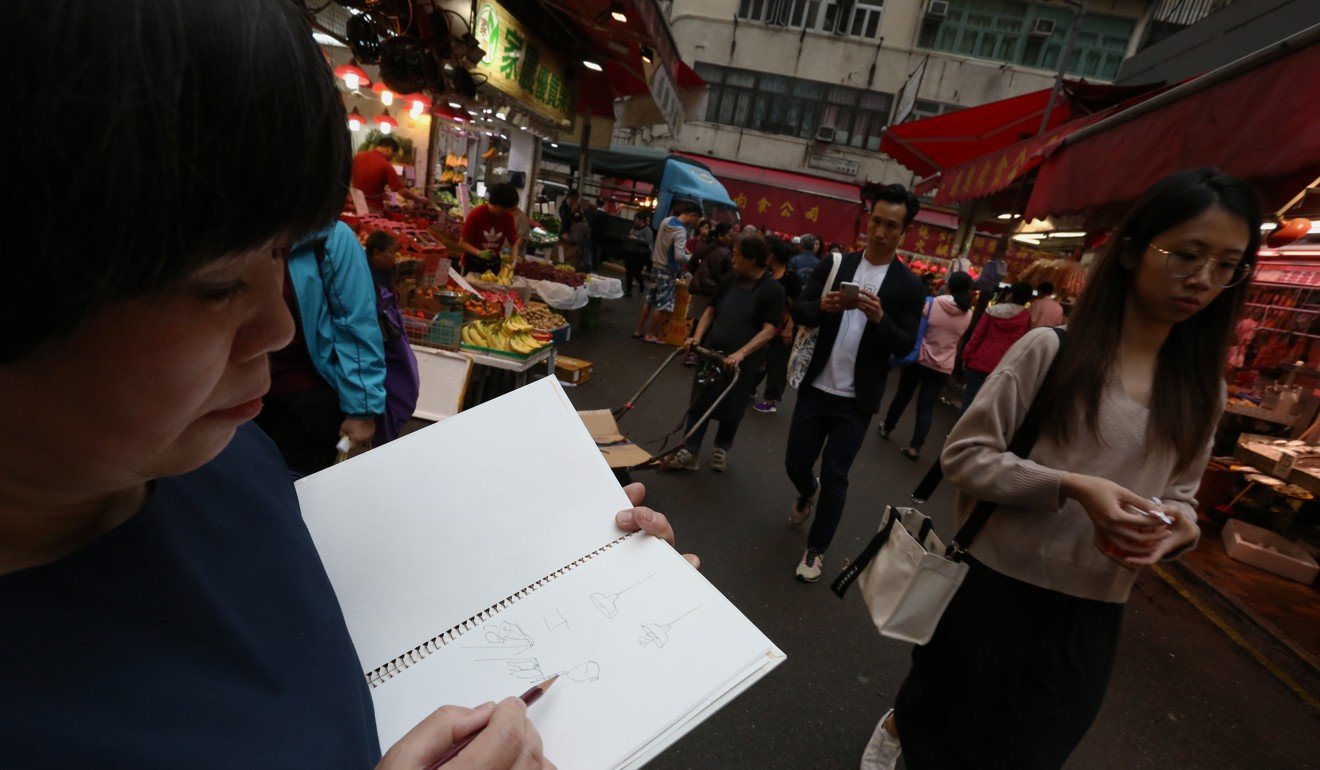 Onodera works on a sketch in a Causeway Bay wet market. Photo: Jonathan Wong