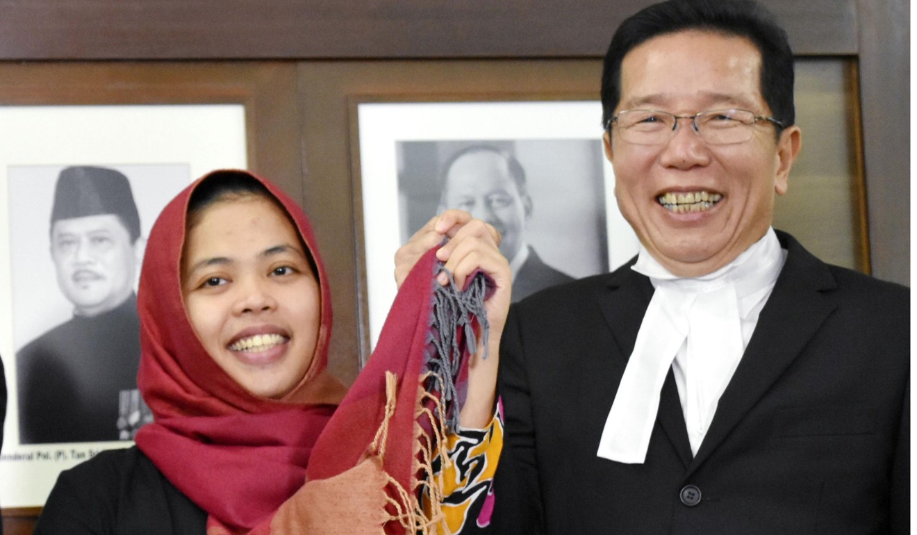 Siti Aisyah from Indonesia smiles following her release from detention on Monday. Photo: Kyodo