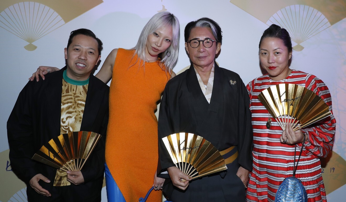 Fashion designers Humberto Leon (left) and Carol Lim (right) with model Soo Joo Park and Takada at the fashion designer’s 80th birthday party in Paris. Photo: Getty