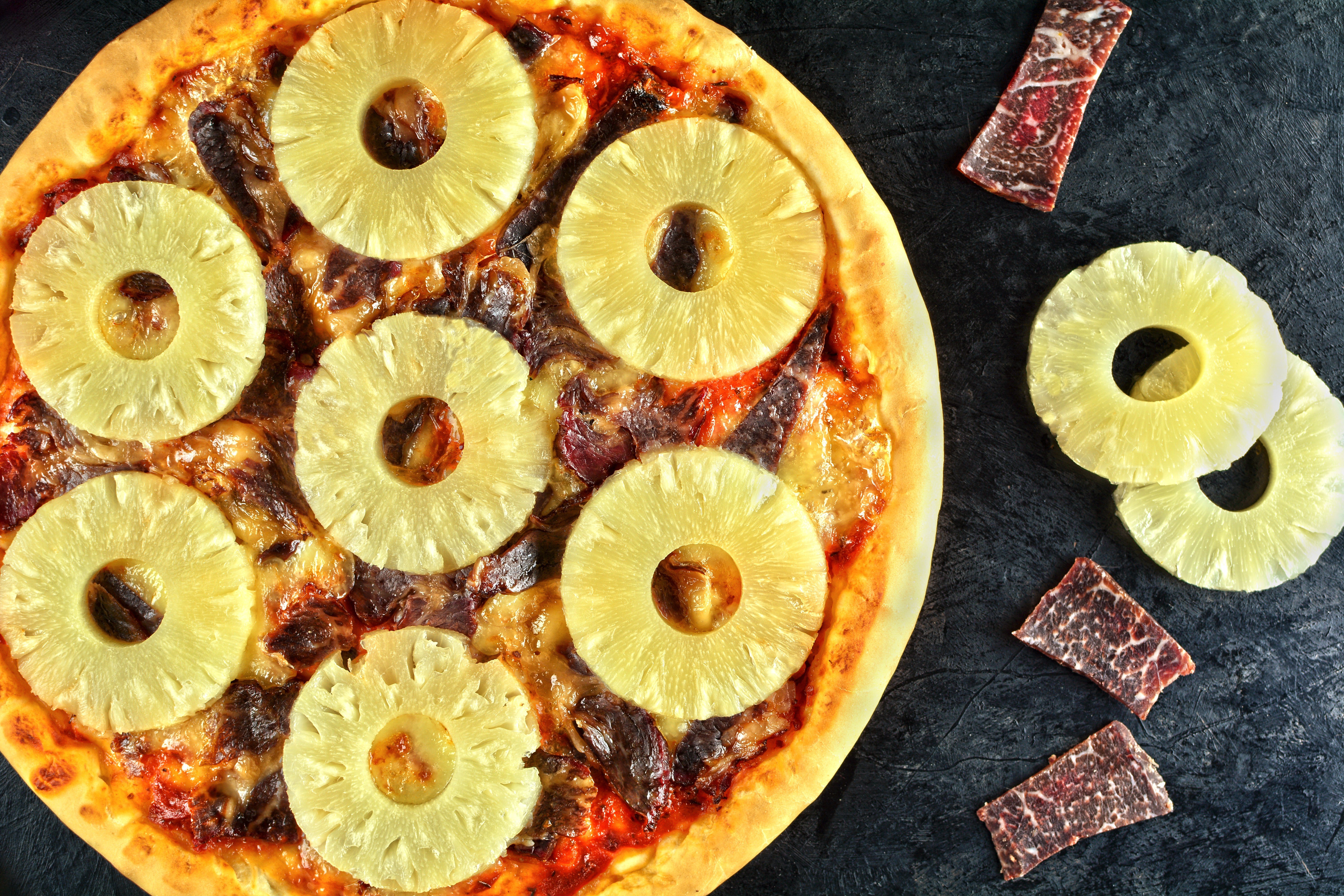Not everyone loves pineapple on pizza, especially when it looks like this. Photo: Shutterstock