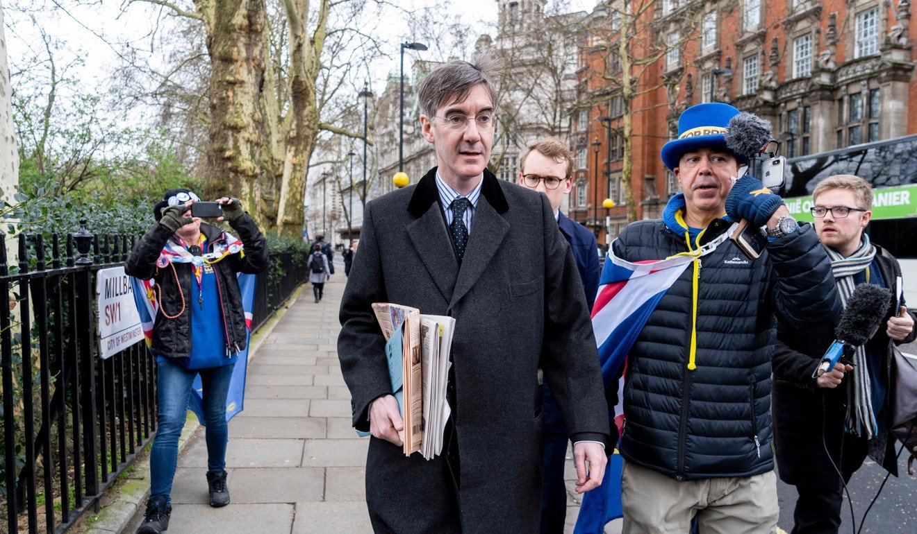 Jacob Rees-Mogg being hounded by anti-Brexit protesters. Photo: AFP