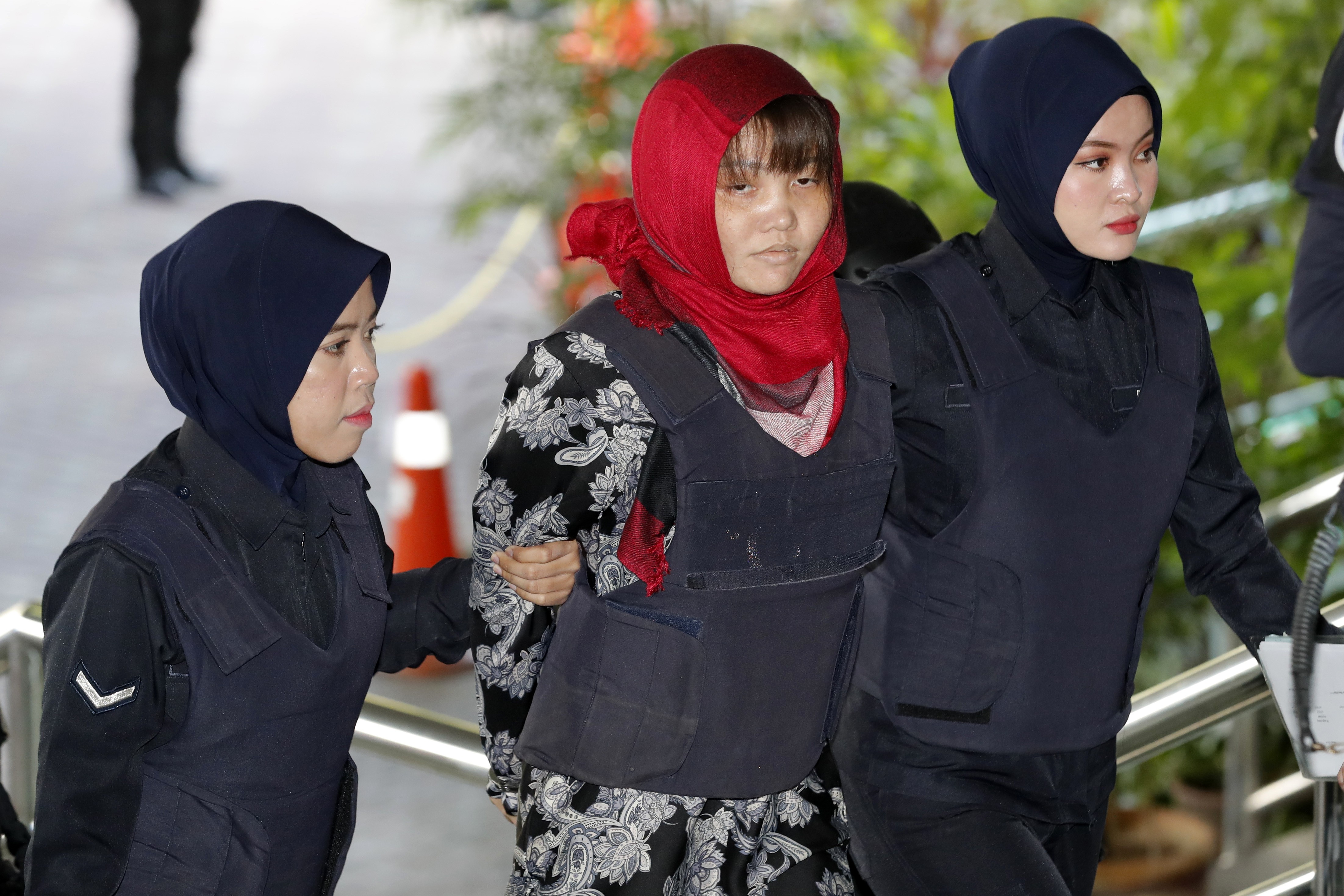 Doan Thi Huong, centre, arrives at Shah Alam High Court in Malaysia on Thursday. Photo: AP