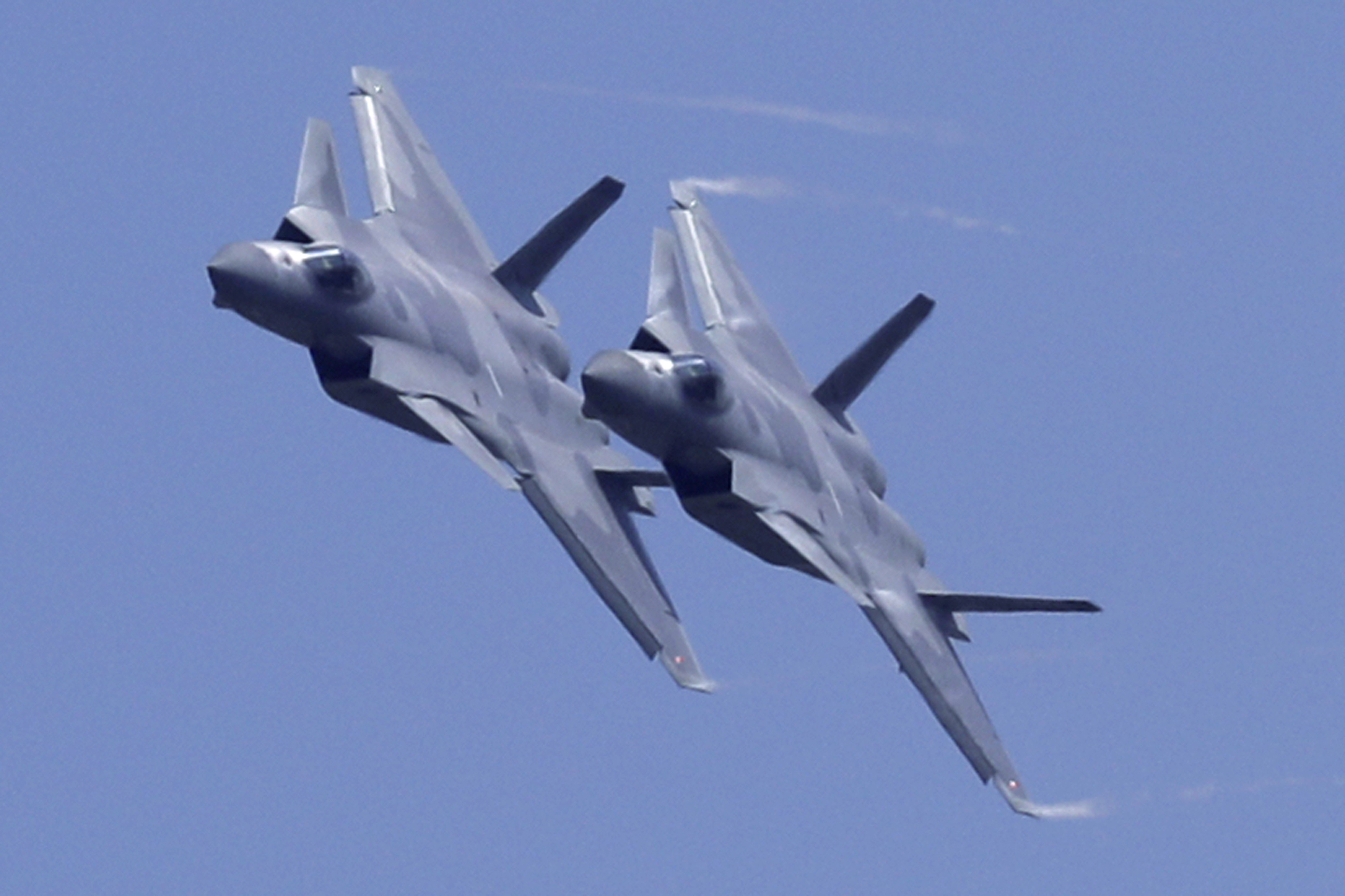 Two J-20 stealth fighter jets perform at an air show in Guangdong province last year. Although they are among China’s most advanced planes, they still rely on Russian engines. Photo: AP