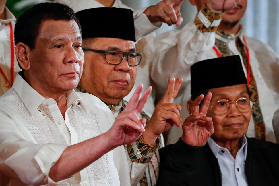 Philippine President Rodrigo Duterte (left) says 46 officials are on a “narco list” of “drug personalities”. Photo: EPA