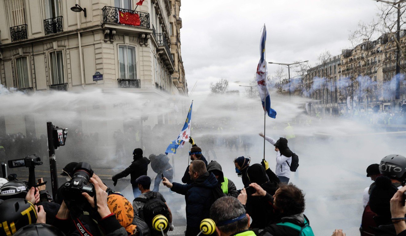 French Police Fire Tear Gas As 'yellow Vest' Protesters Loot Paris ...