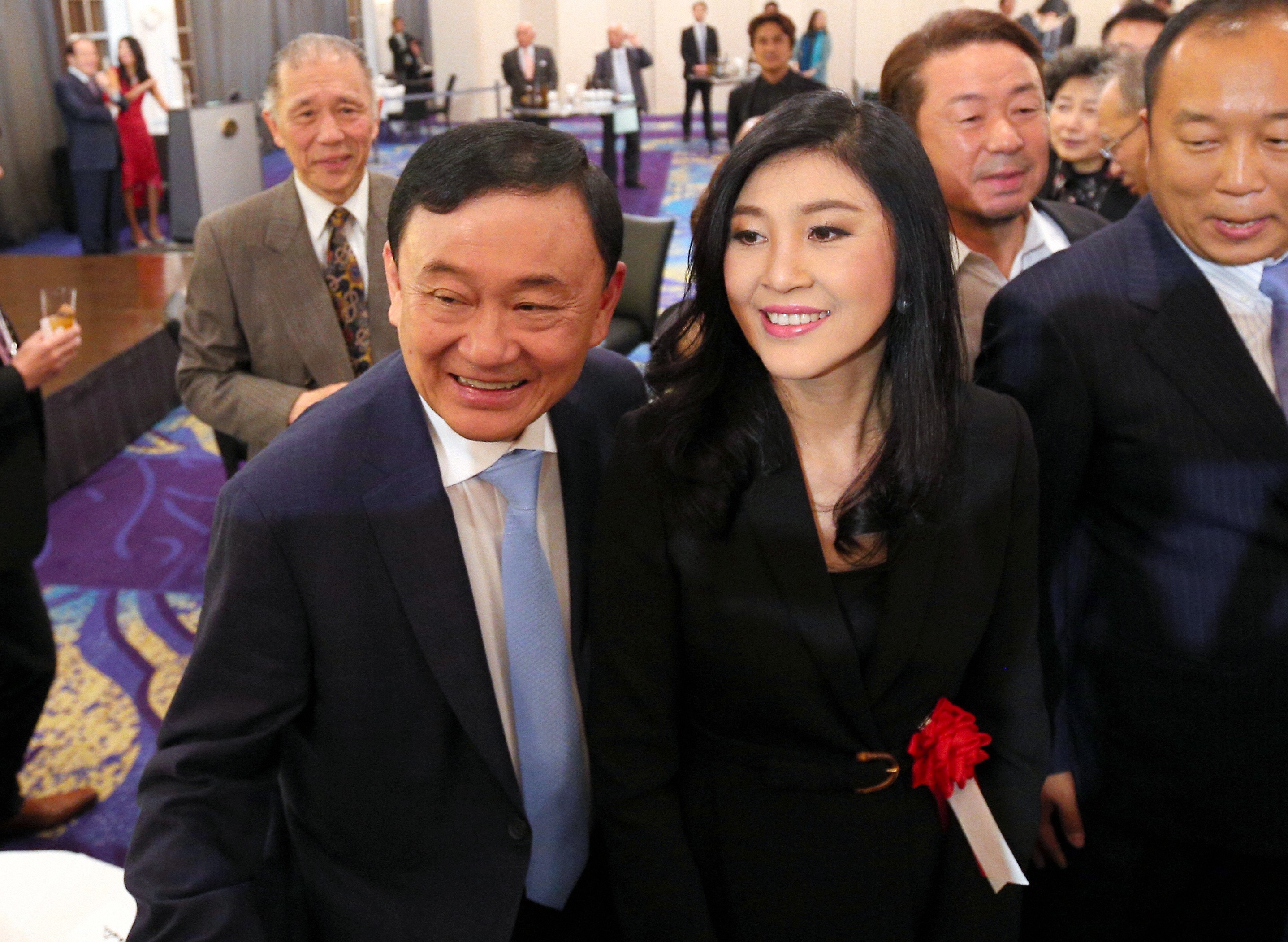 Thaksin and Yingluck Shinawatra at an event in Tokyo in March last year. Photo: AFP