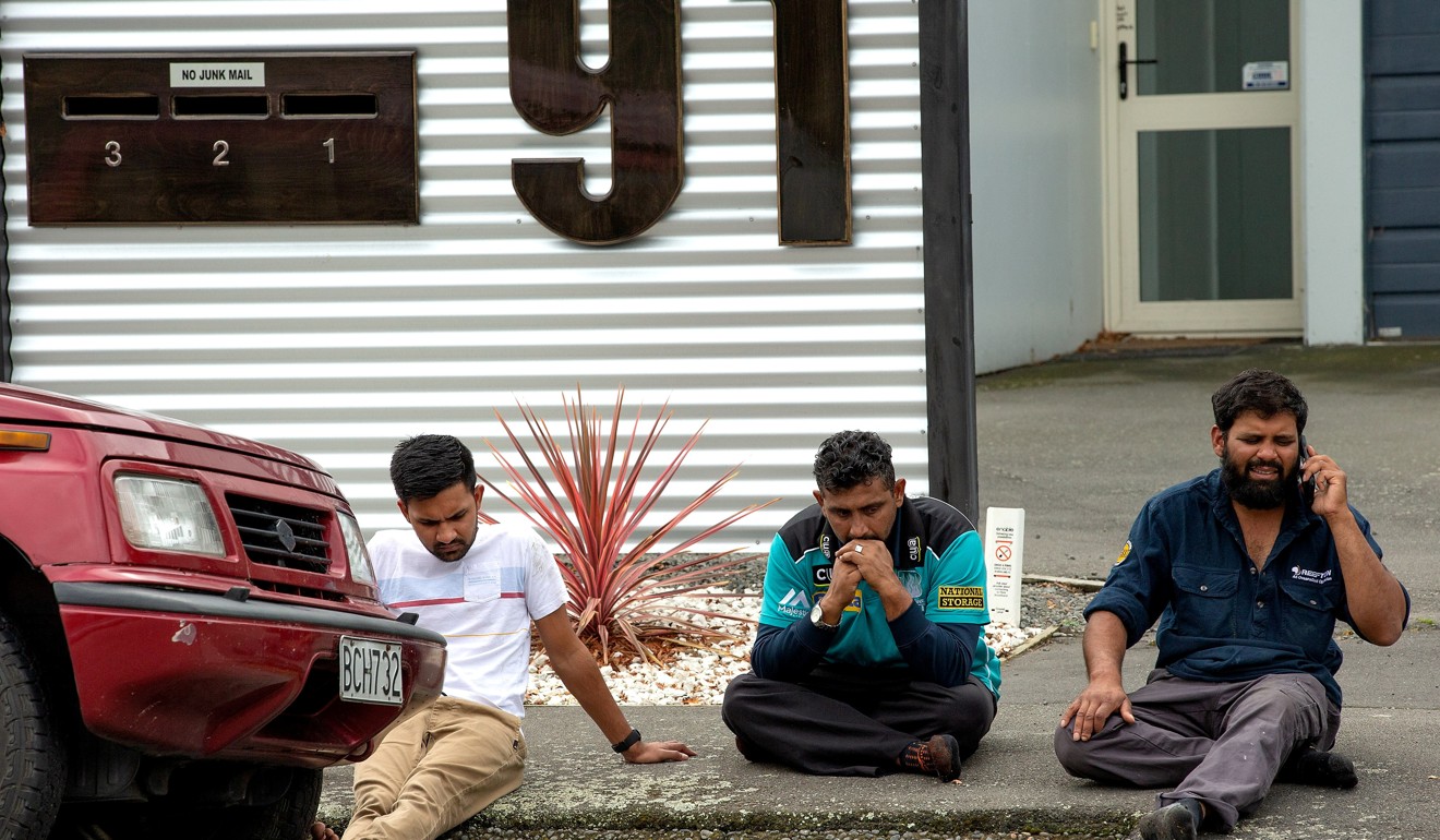 Grieving members of the public following a shooting at the Al Noor mosque in Christchurch. Photo: Reuters