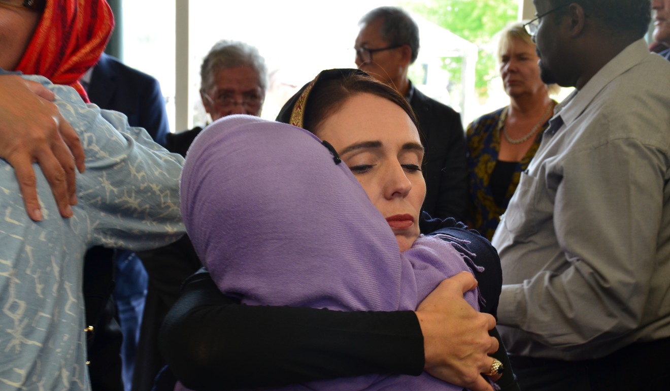 New Zealand Prime Minister Jacinda Ardern (C) with members of the Muslim community in Christchurch. Photo: EPA-EFE
