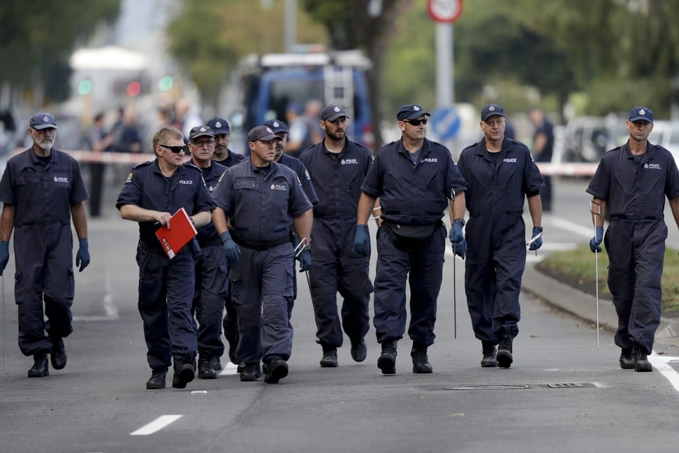 Police search the area near the Masjid Al Noor mosque in Christchurch on Saturday. It was one of two mosque attacked a day earlier. Photo: AP