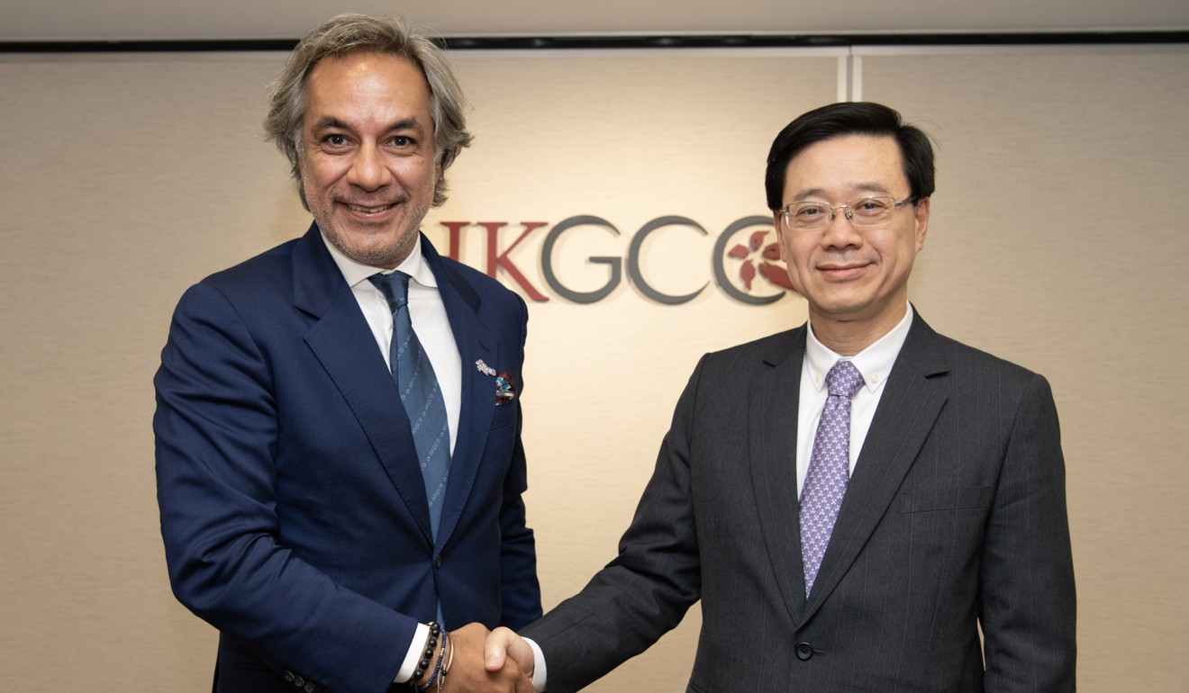Aron Harilela, chairman of Hong Kong General Chamber of Commerce (left) and Secretary for Security John Lee. Photo: Handout