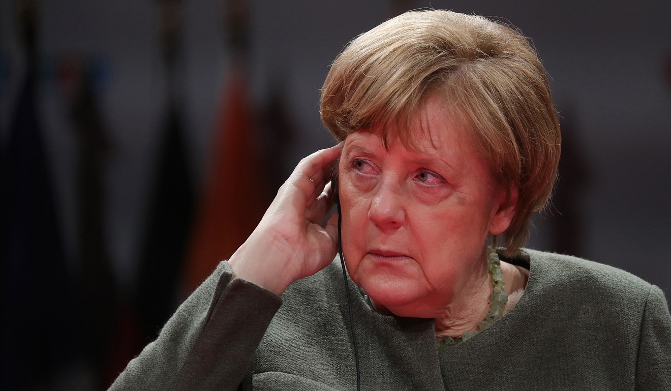 German Chancellor Angela Merkel listens during a question-and-answer session at the Global Solutions World Policy Forum in Berlin on Tuesday. Photo: Bloomberg/Krisztian Bocsi