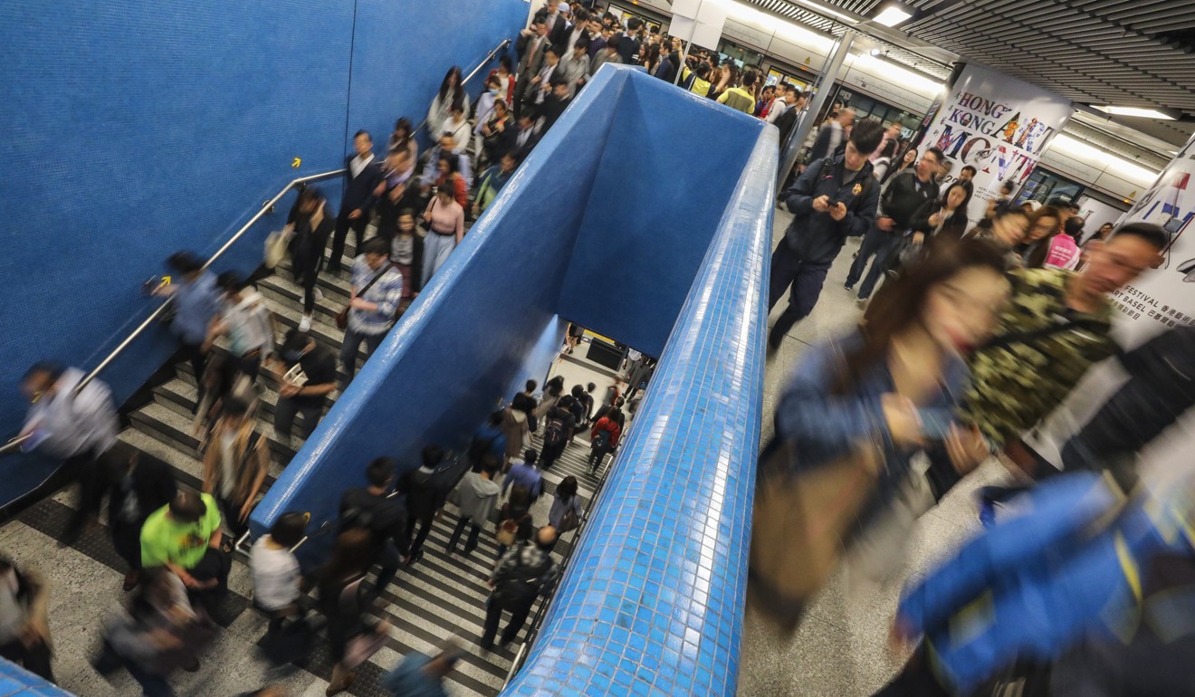 Commuters queue up for the MTR Island Line at Admiralty station, after trains on the Tsuen Wan line were disrupted between Central and Admiralty stations. Photo: Felix Wong/SCMP
