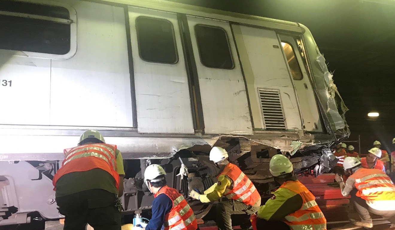 MTR staff carrying out repair works on the derailed train in the early hours of Tuesday. Photo: Handout