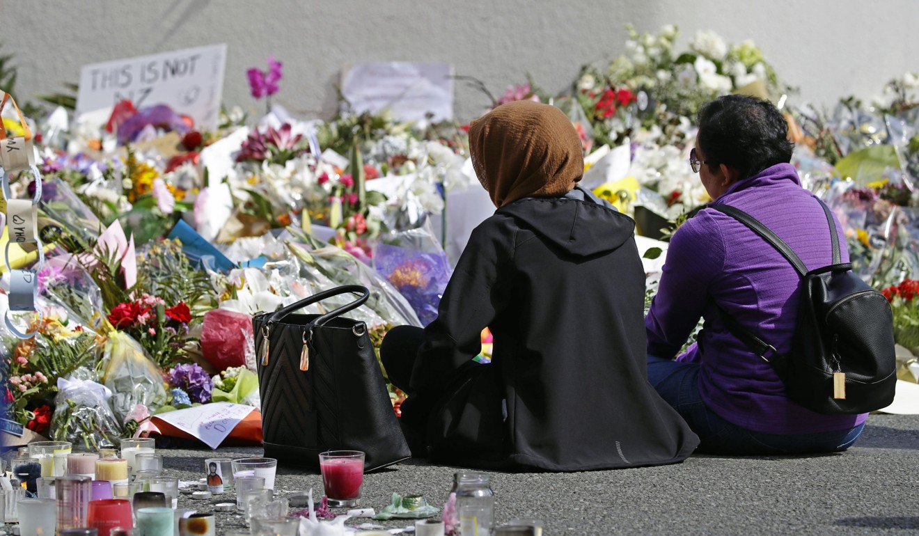 People mourn near the Al Noor mosque in Christchurch. Photo: Kyodo