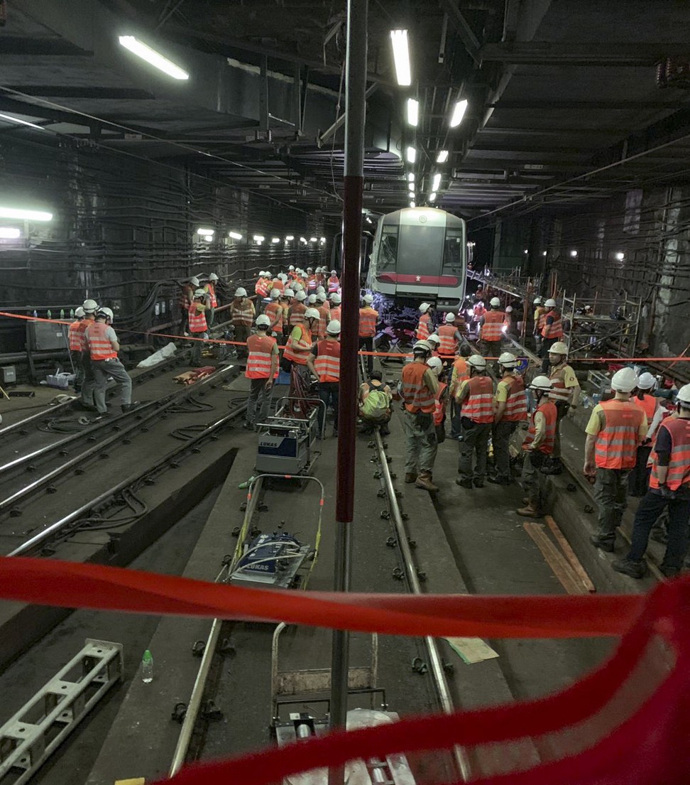 Railway employees work on moving the train in the tunnel. Photo: Handout