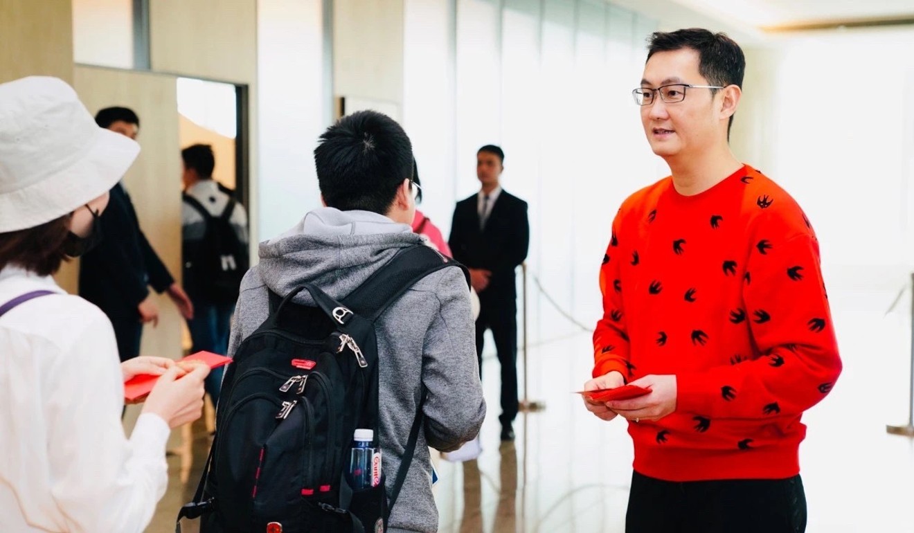 Tencent Holdings founder, chairman and chief executive Pony Ma Huateng gives out red packets for the Lunar New Year to staff at the company’s Shenzhen headquarters in February. Photo: Handout