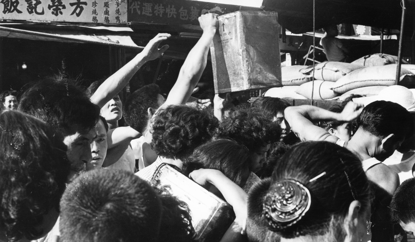 Residents of Kowloon City crowd around a water hydrant during the drought of May 1963. Photo: SCMP Pictures