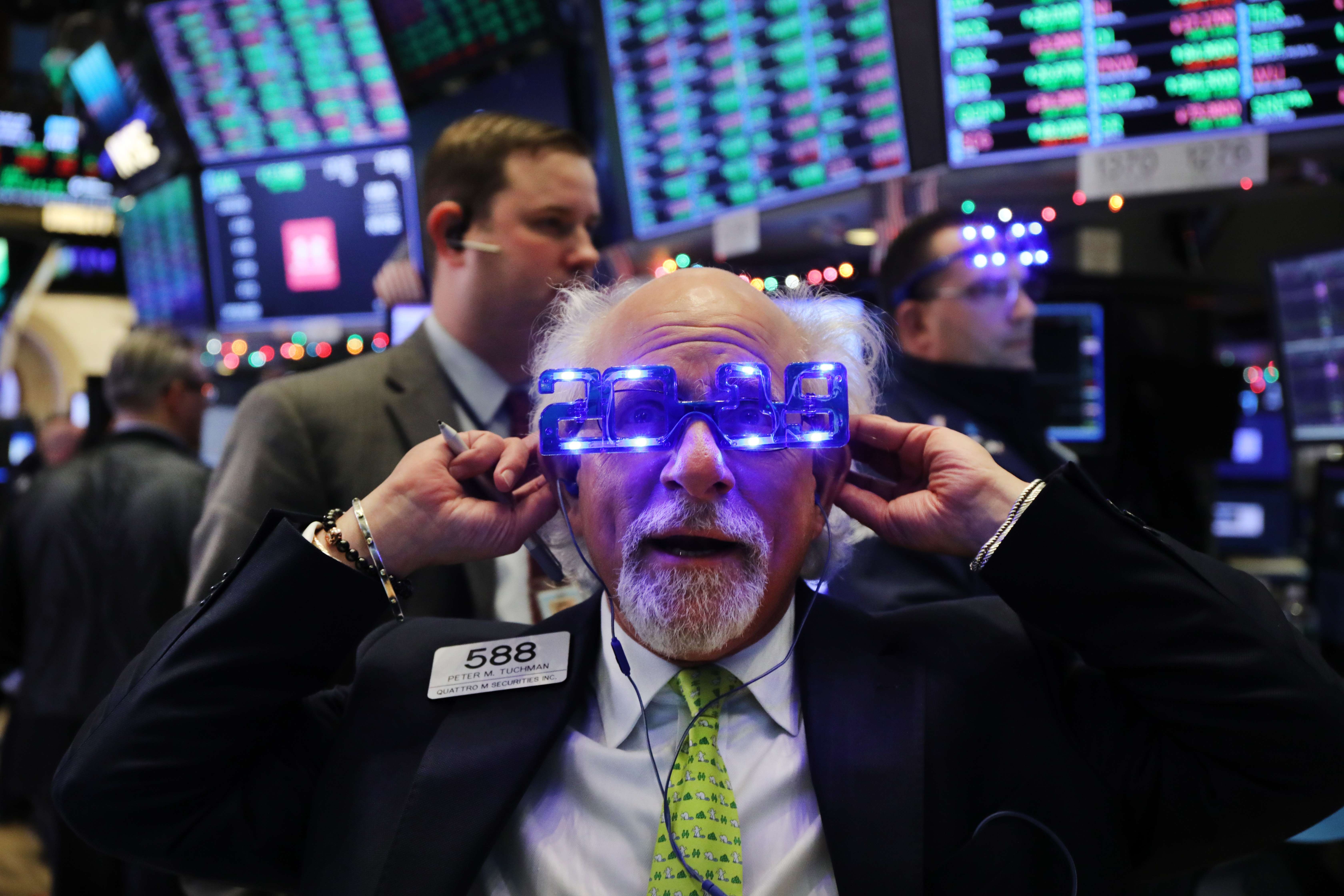 Traders work on the floor of the New York Stock Exchange on the last day of the trading year on December 31, 2018. The Dow finished up over 250 points on the final day of 2018. Photo: AFP