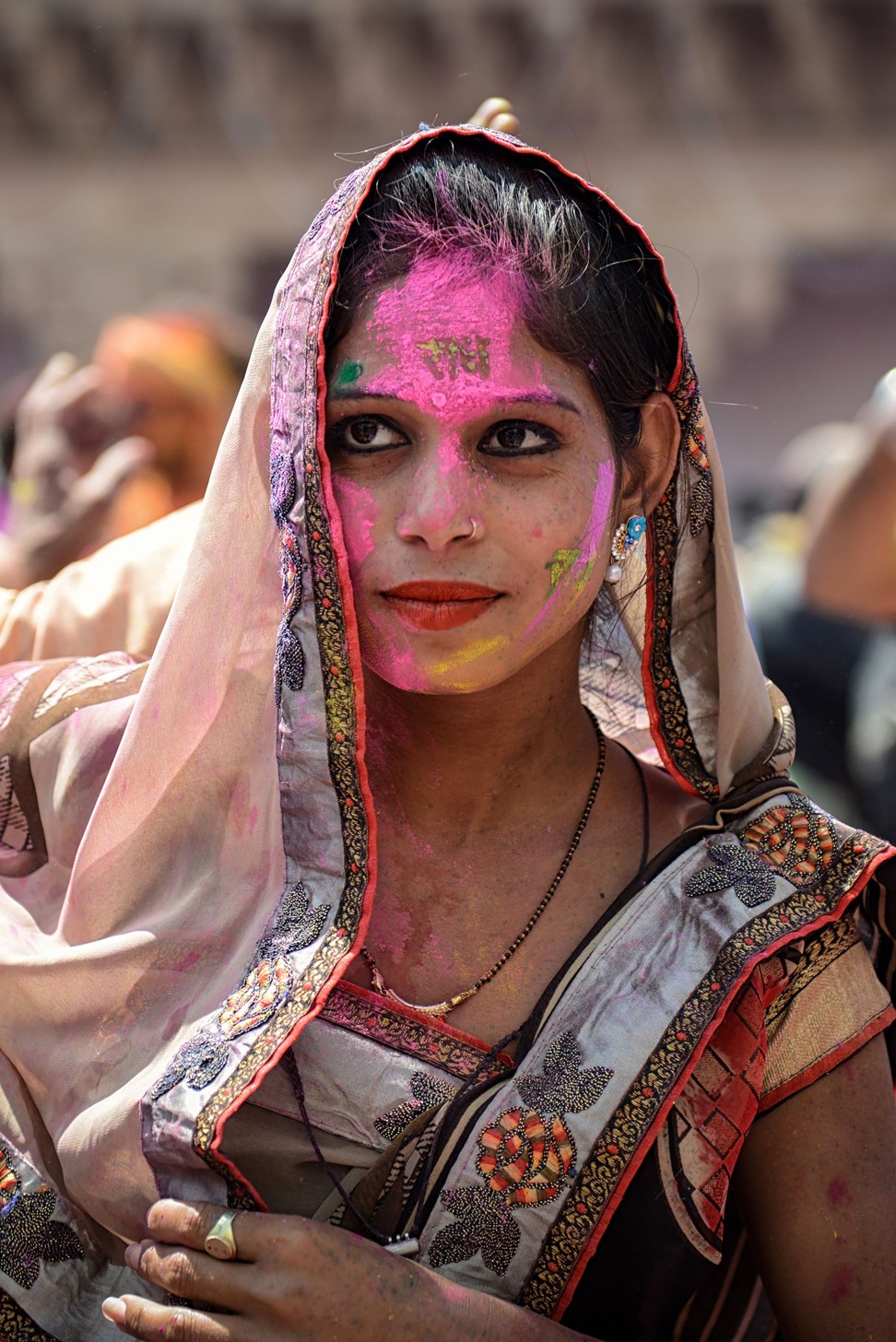 A woman celebrating Holi during a traditional gathering at a temple in Nandgaon village in Uttar Pradesh state. Photo: AFP