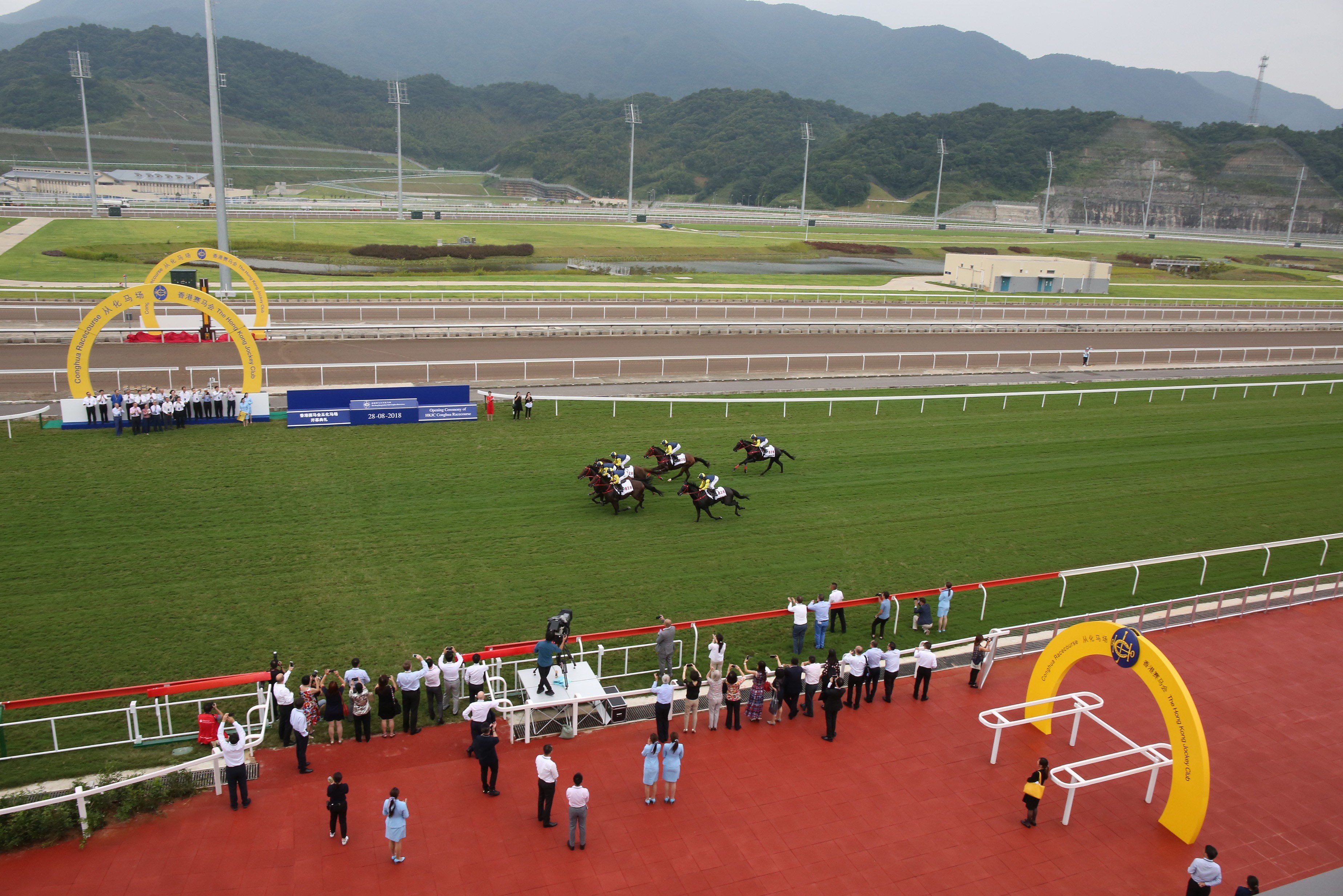 Six horses gallop down the straight at the opening of the Conghua Racecourse in August. Photos: Kenneth Chan