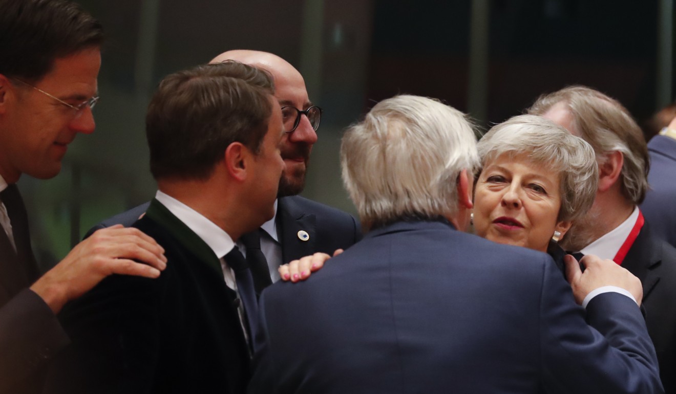 British Prime Minister Theresa May, right, speaks with European Commission President Jean-Claude Juncker. Photo: AP Photo