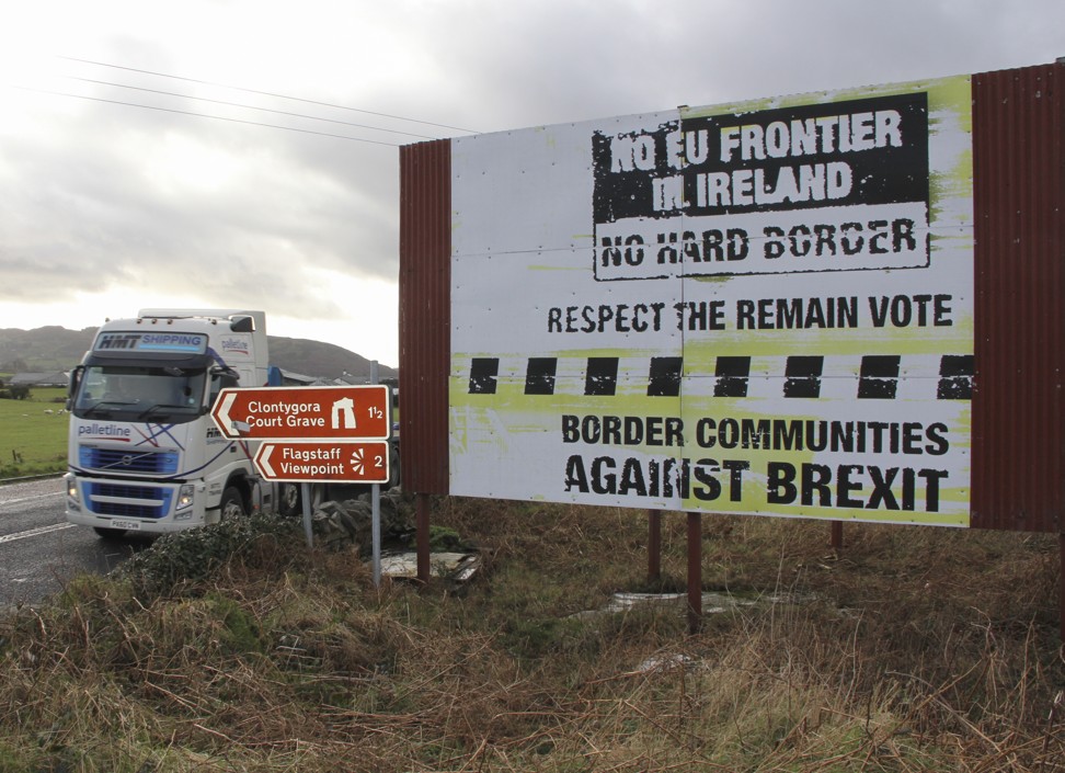 A hoarding opposing a hard border with the Irish republic beside a road in Northern Ireland. Photo: Peter Simpson
