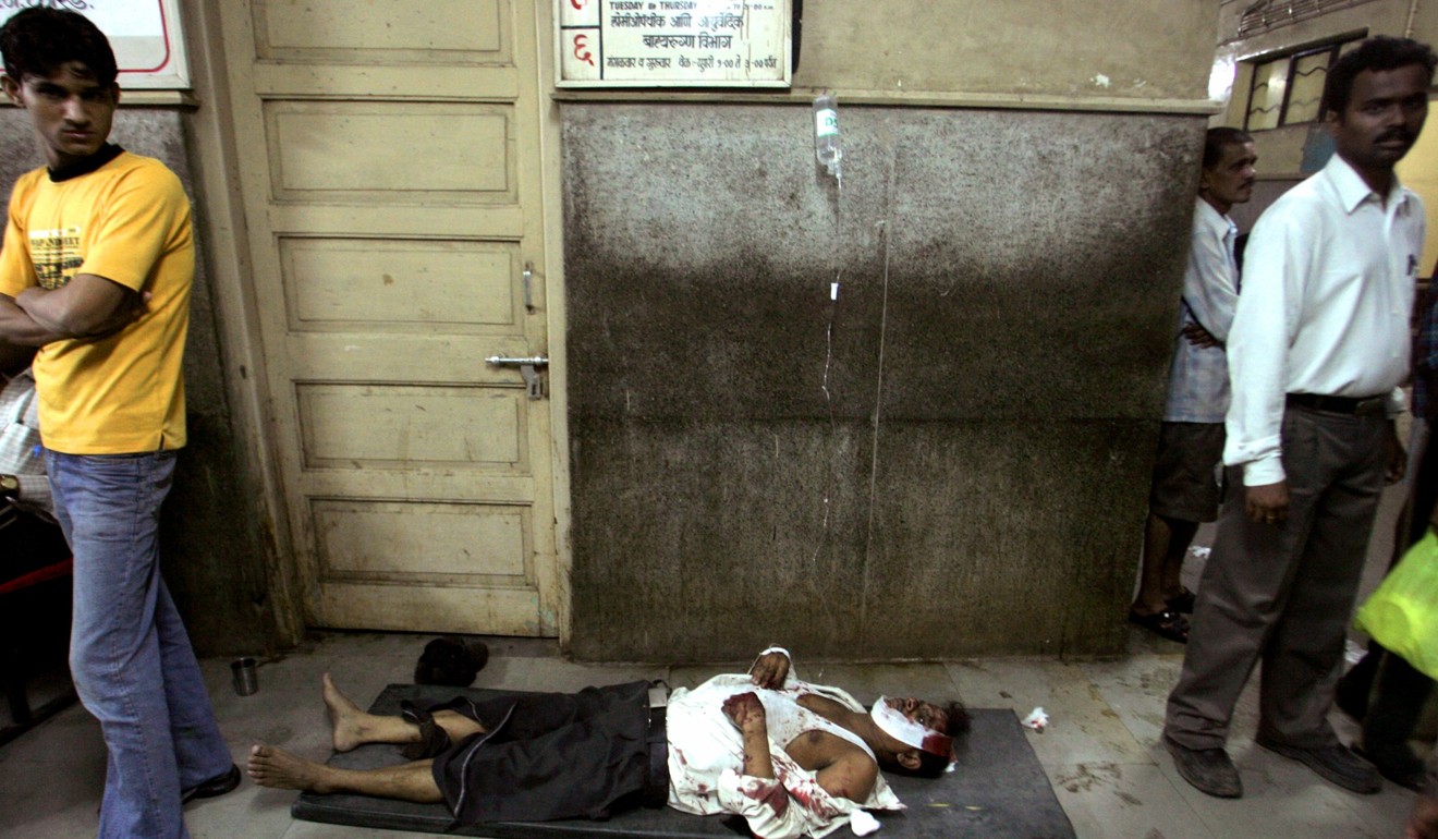 A victim of a train blast lies on the floor of a hospital in Mumbai in 2006. More than 100 people were killed in seven bomb explosions at rail stations and on trains in India’s financial hub. Photo: Reuters
