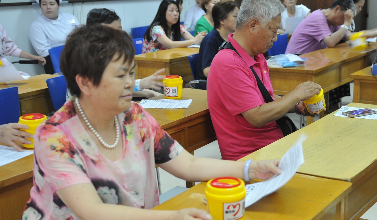 Diabetes patients listen to a talk on using sharp waste boxes. Photo: Handout